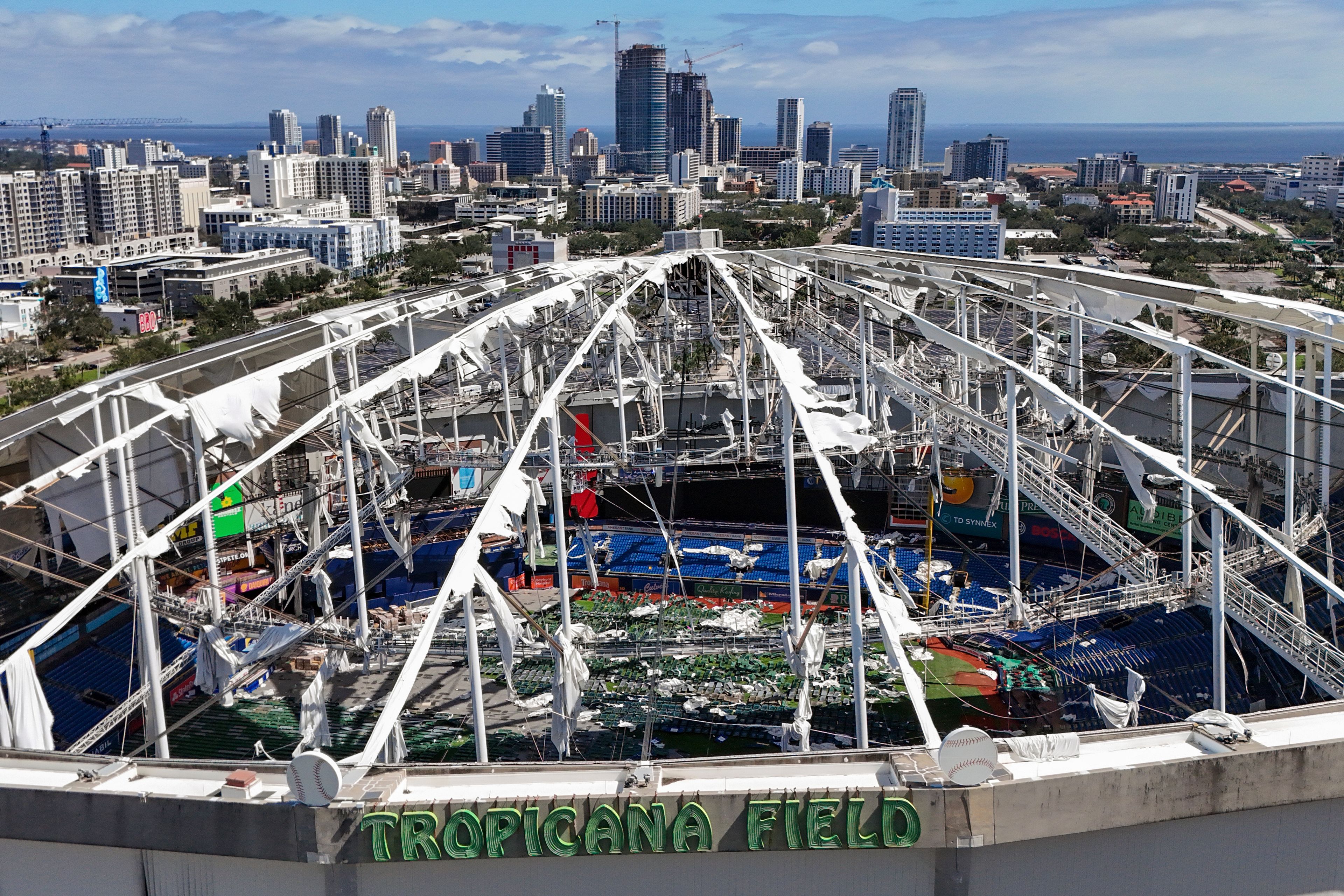 FILE - The roof of the Tropicana Field is damaged the morning after Hurricane Milton hit the region, Thursday, Oct. 10, 2024, in St. Petersburg, Fla. (AP Photo/Mike Carlson, File)