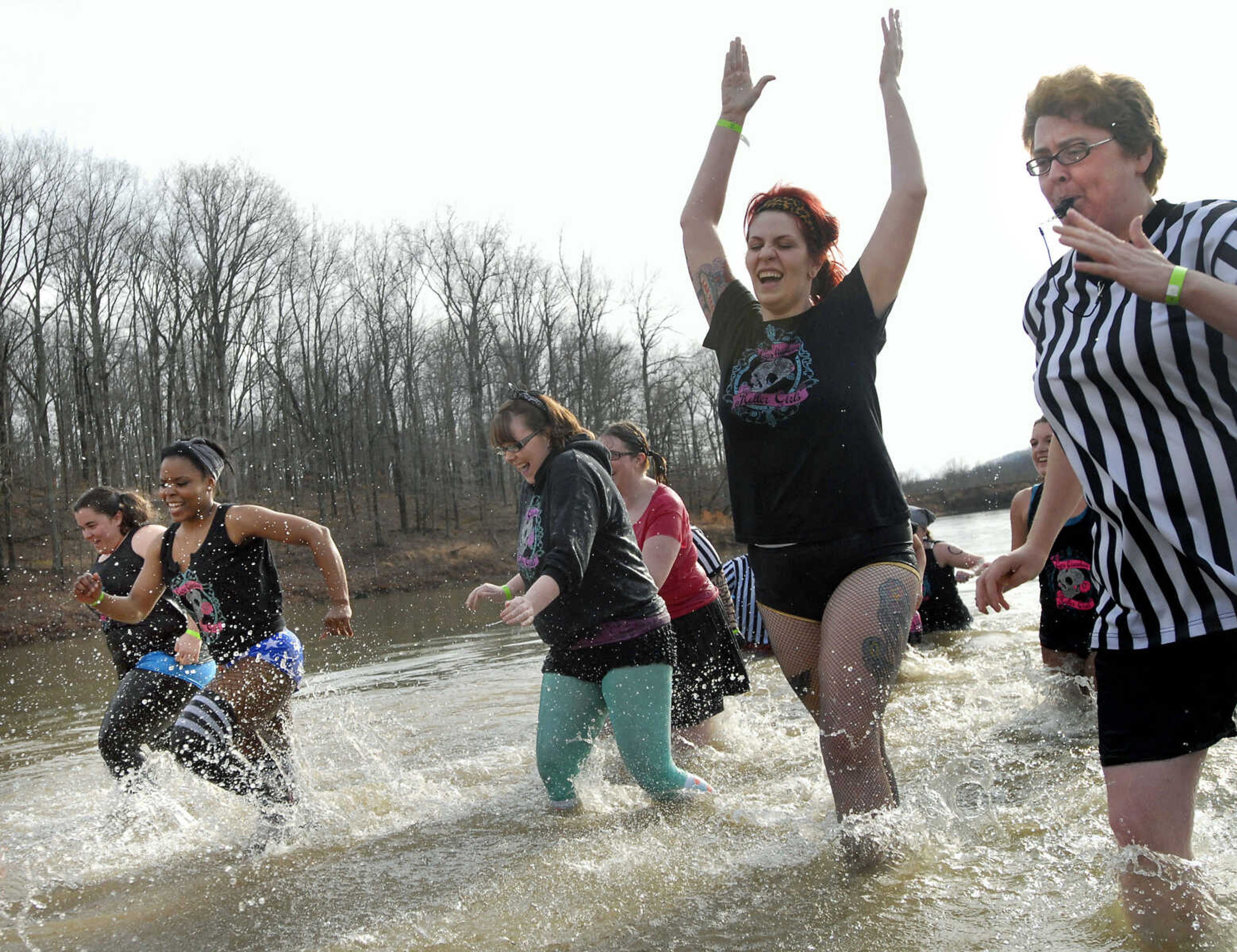 KRISTIN EBERTS ~ keberts@semissourian.com

The Cape Girardeau Roller Girls' team splashes through the water during the 2012 Polar Plunge at the Trail of Tears State Park's Lake Boutin on Saturday, Feb. 4, 2012.