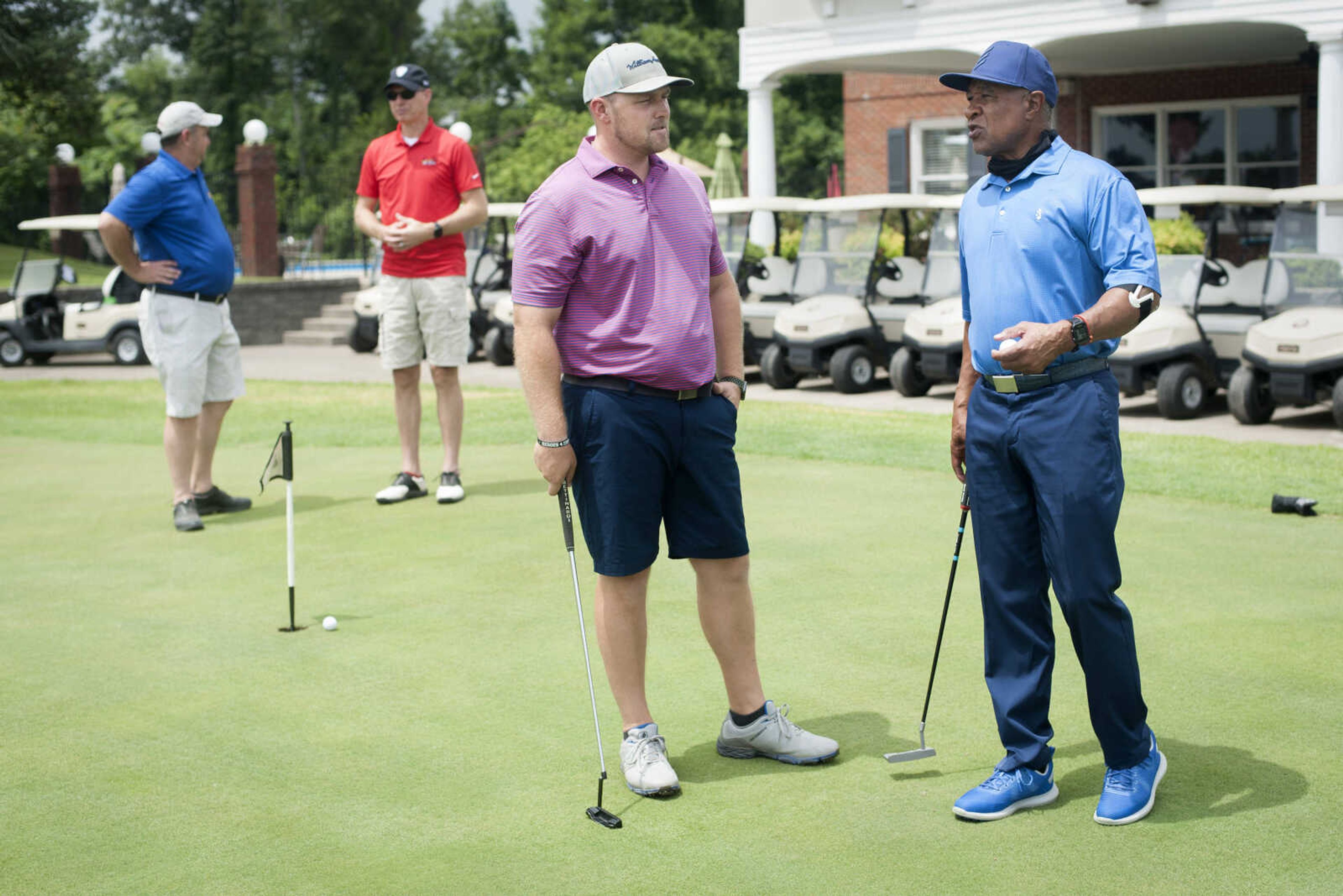 Brandon Cooper talks to former St. Louis Cardinals shortstop and Hall of Famer Ozzie Smith before a round of golf Friday, June 26, 2020, at the Cape Girardeau Country Club.