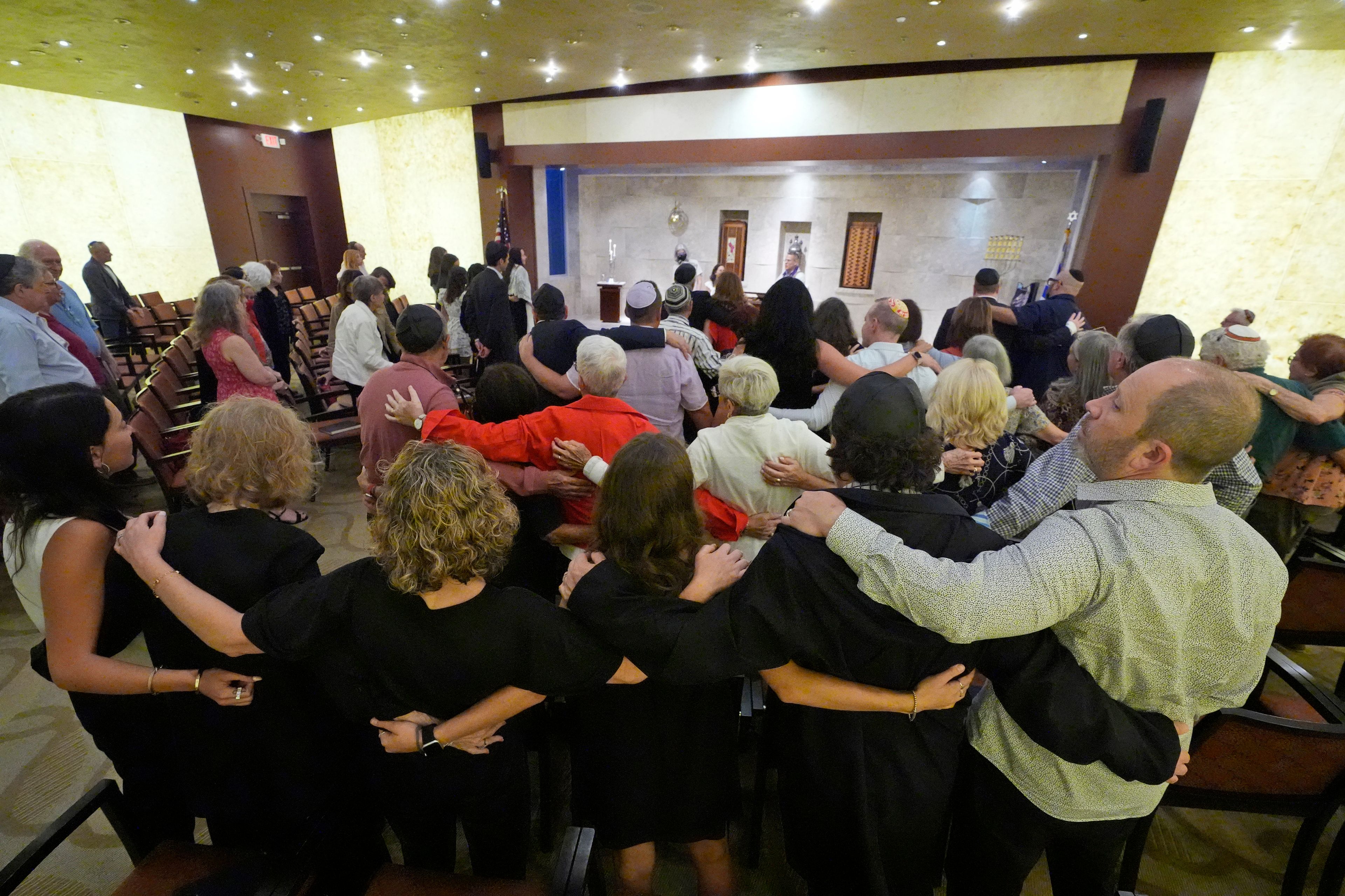 Worshipers sing as they pray for peace, during a Shabbat service, Friday, Sept. 27, 2024, at Temple Beth Sholom in Miami Beach, Fla. (AP Photo/Wilfredo Lee)