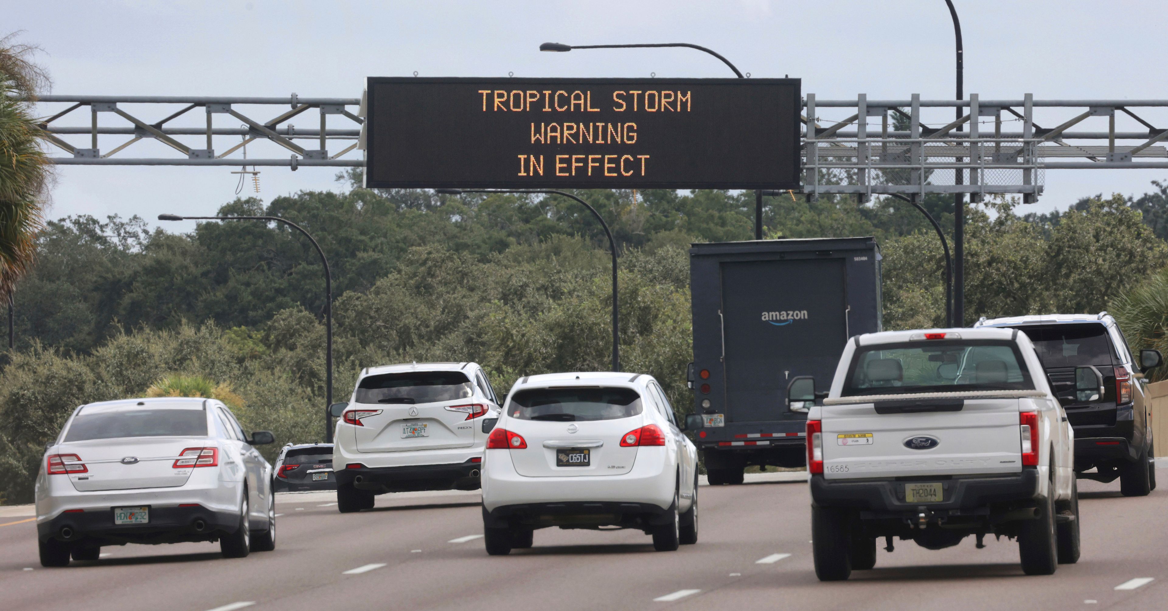 A traffic advisory sign on westbound S.R. 408 near downtown Orlando, Fla., informs commuters of the approaching Hurricane Helene, Wednesday, Sept. 25, 2024. (Joe Burbank/Orlando Sentinel via AP)