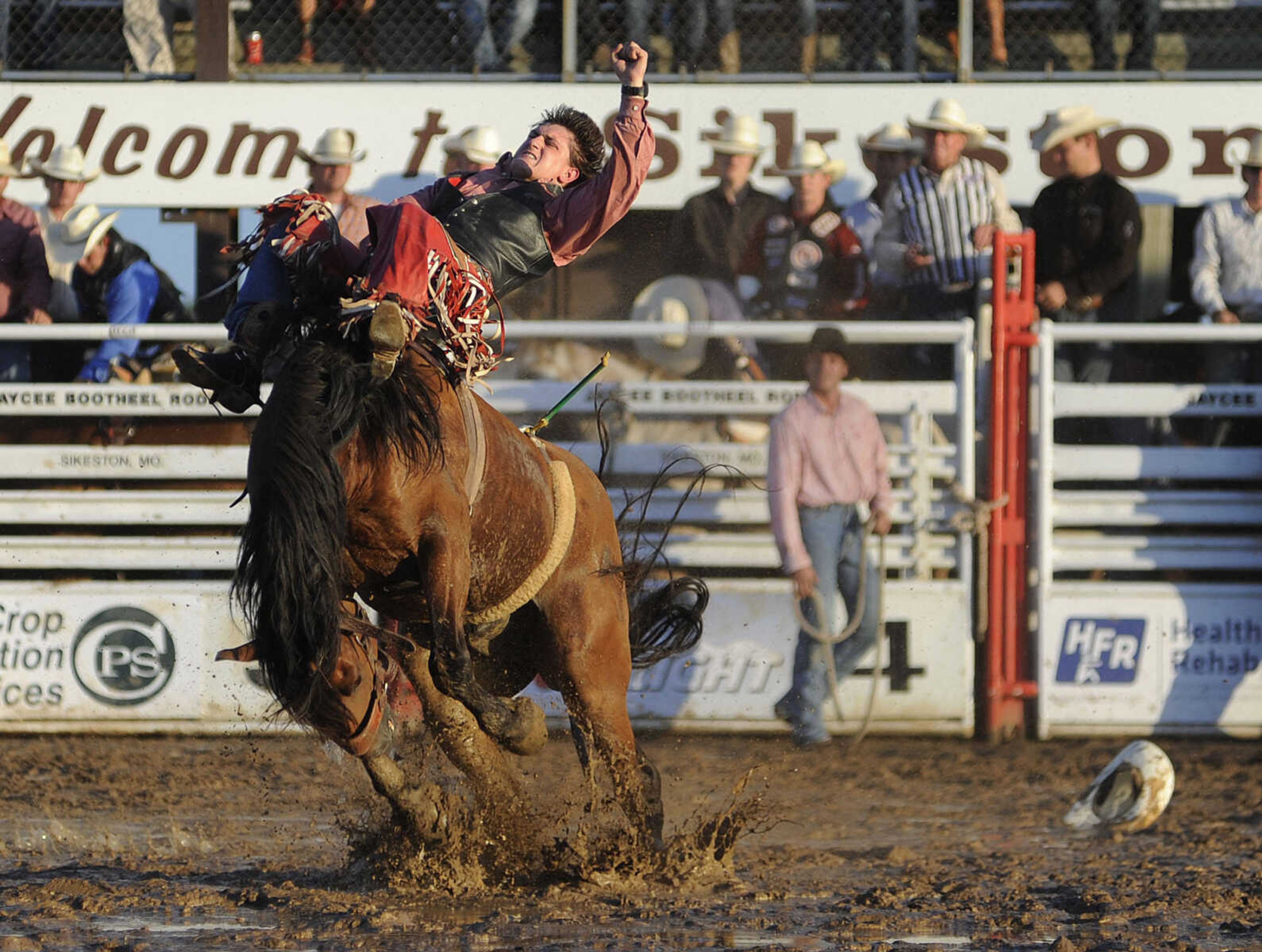 Taylor Price rides Prairie Wind in the bareback riding competition at the Sikeston Jaycee Bootheel Rodeo Wednesday, August 7, in Sikeston, Mo. Price received a score of 84 for his ride.