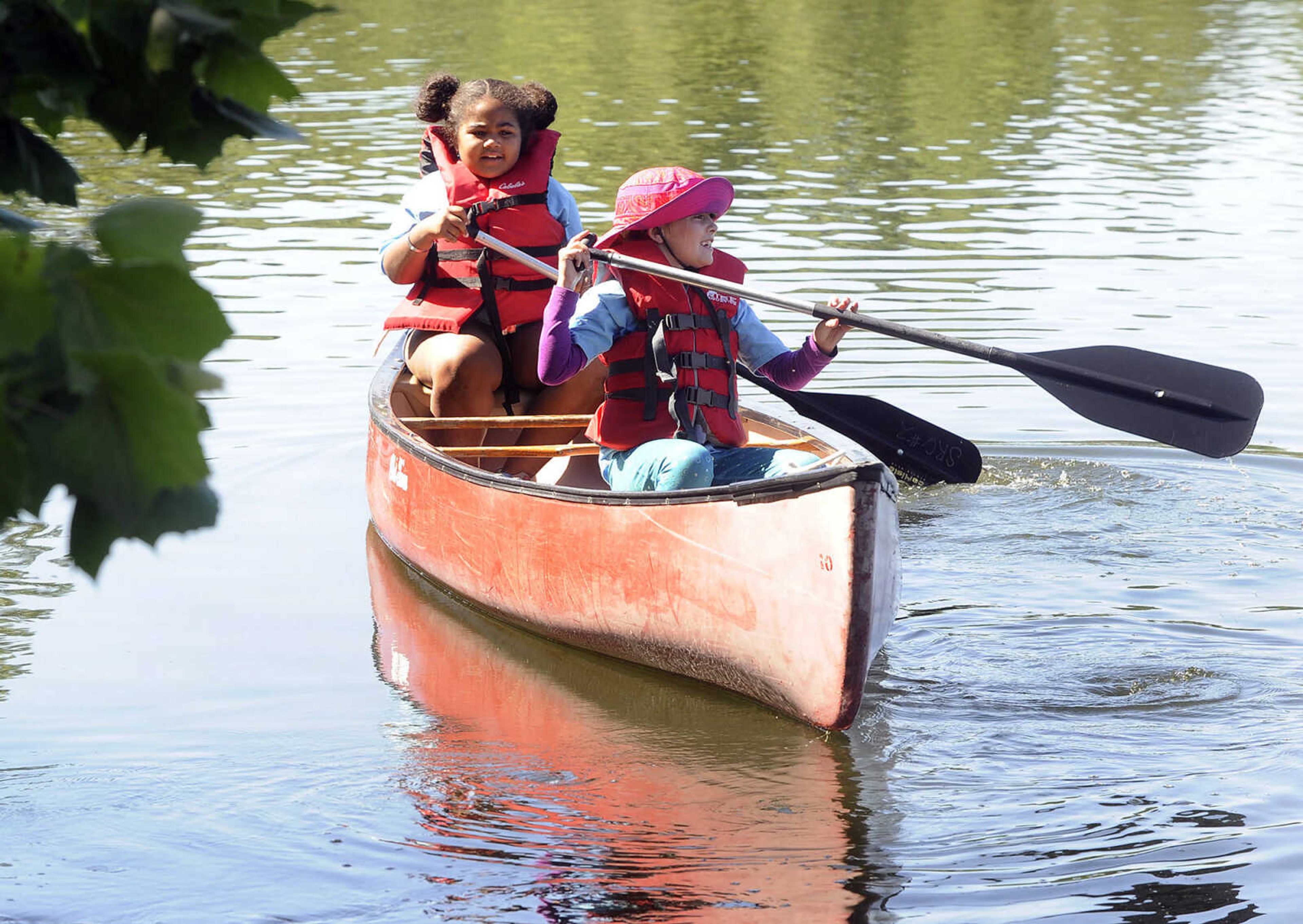 FRED LYNCH ~ flynch@semissourian.com
Brownie Girl Scouts Malia Criddle, left, and Katherine Godbey paddle a canoe Thursday, June 8, 2017 at Elks Lake in Cape Girardeau. They were among 135 girls at the week-long day camp sponsored by Girl Scout Service Unit 771.