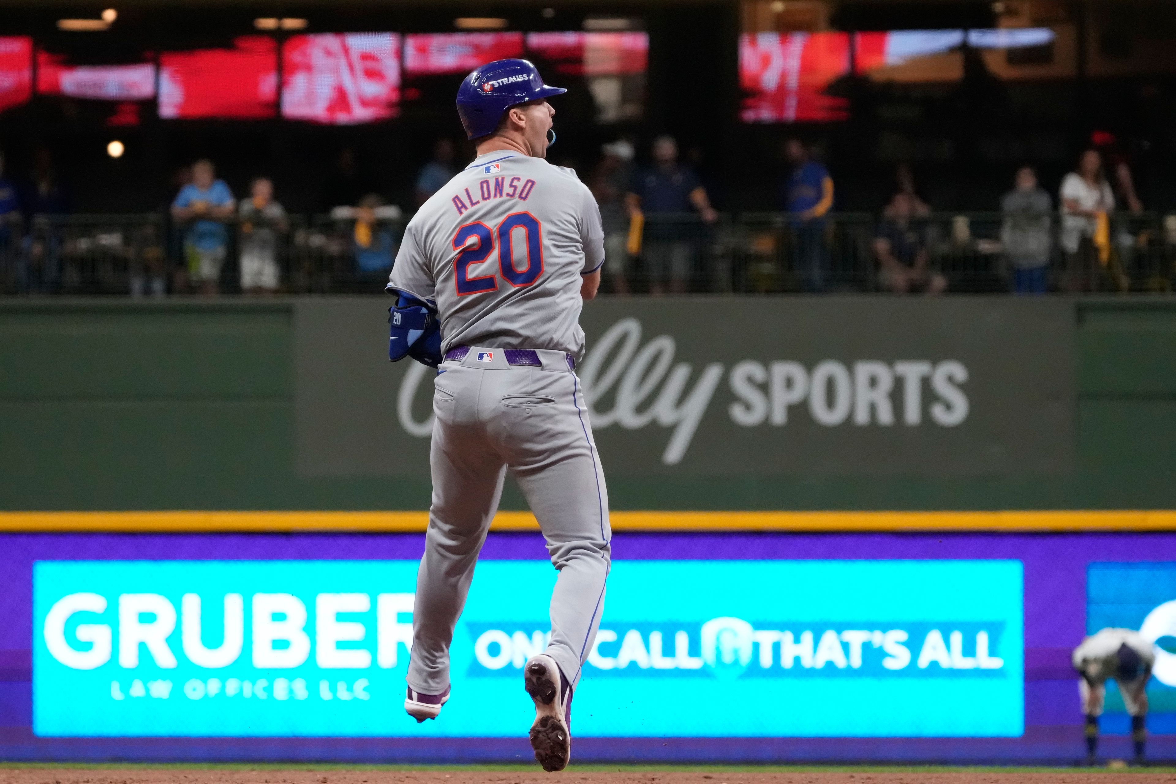 New York Mets' Pete Alonso reacts after hitting a three-run home run during the ninth inning of Game 3 of a National League wild card baseball game against the Milwaukee Brewers Thursday, Oct. 3, 2024, in Milwaukee. (AP Photo/Morry Gash)