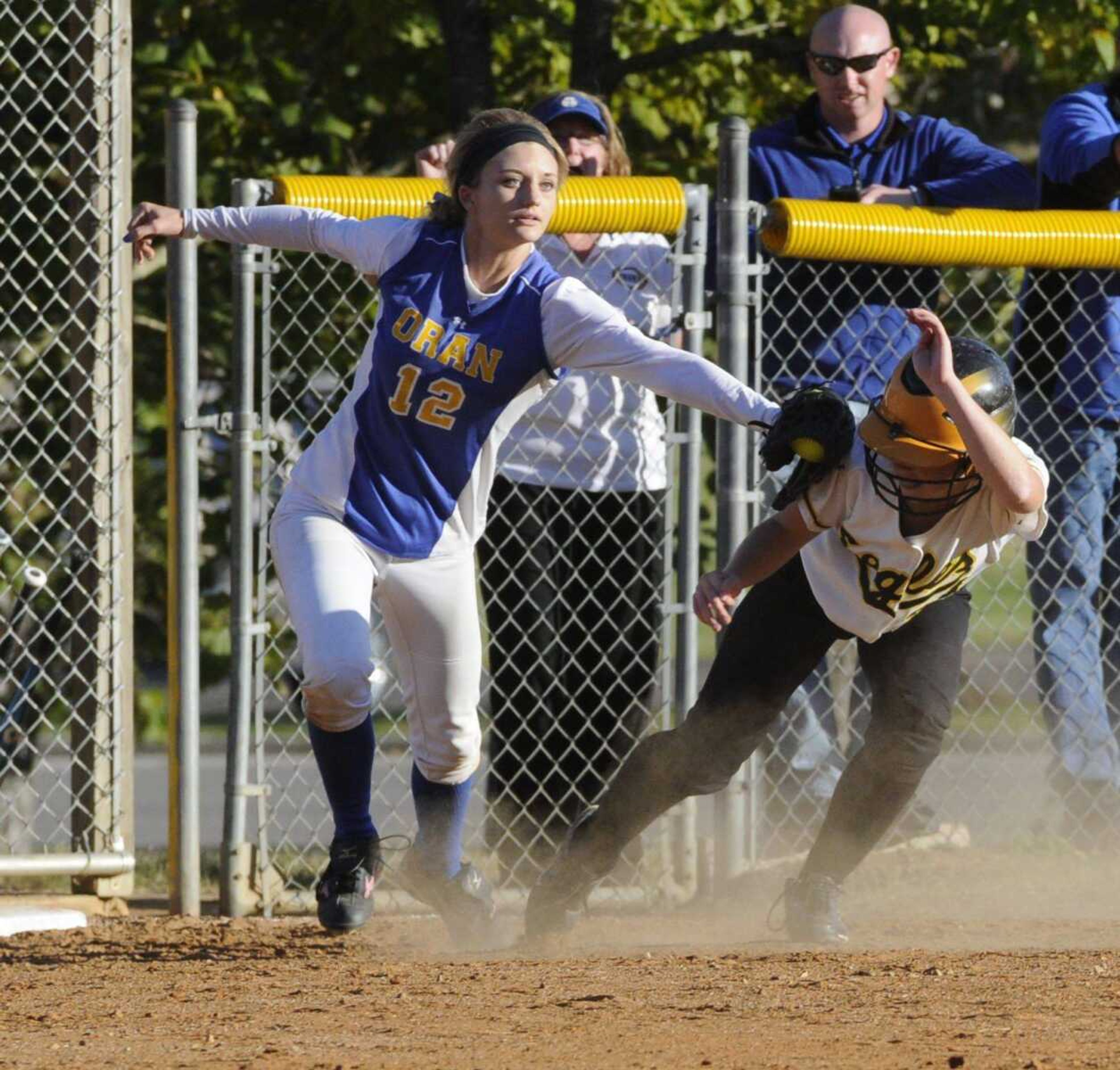 Oran third baseman Addie Kielhofner (12) tags out tags out Kala Johnson (20) during the sixth inning Monday, Oct. 8, 2012, during the MSHSAA Class 1 District 1 championship game at Rains Field in Poplar Bluff, Mo. (DAILY AMERICAN REPUBLIC/Brian Rosener)