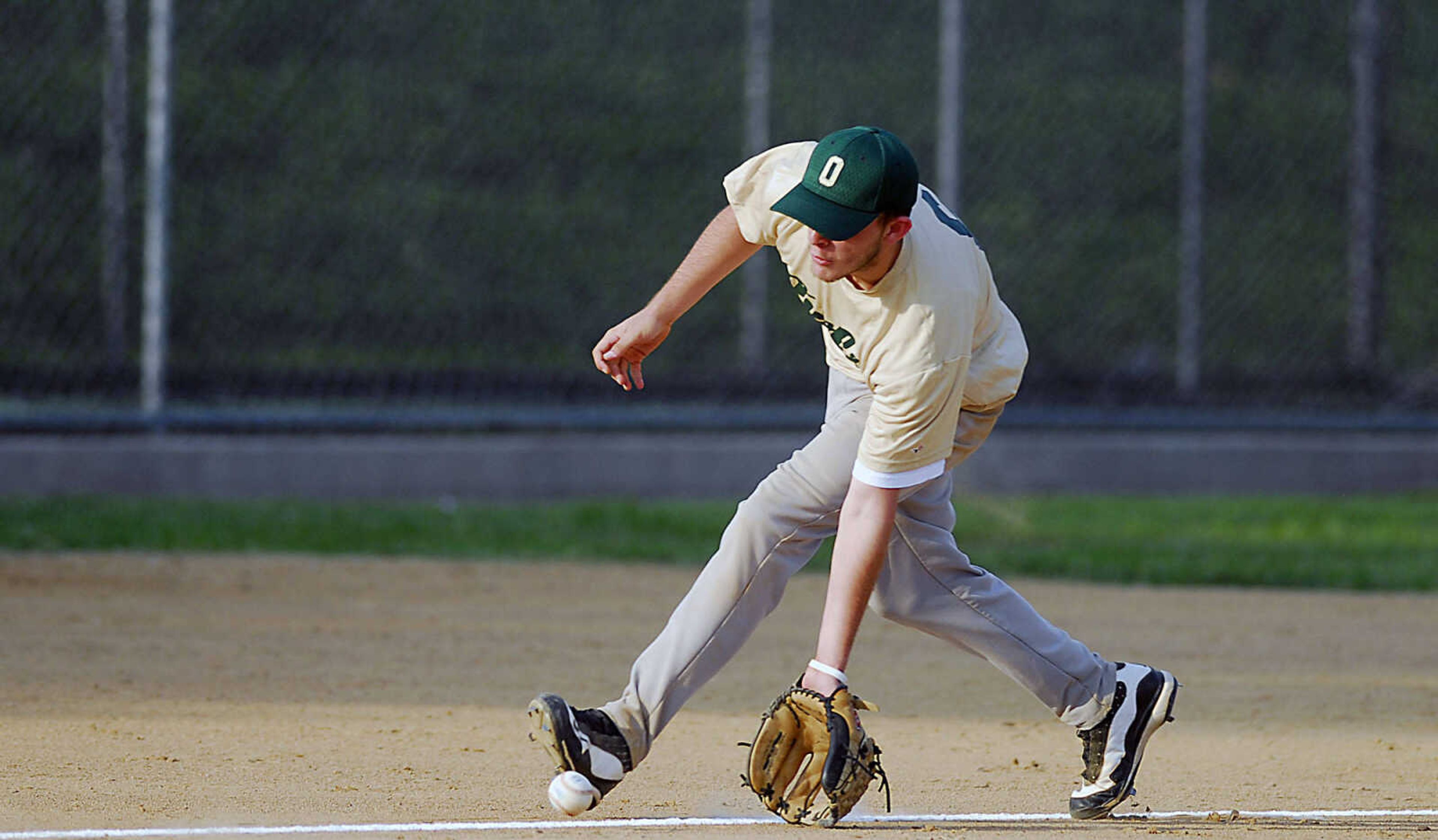 KIT DOYLE ~ kdoyle@semissourian.com
New Madrid third baseman Jay Singleton scoops up a slow roller down the line Monday evening, July 6, 2009, in a Senior Babe Ruth game at Jackson City Park.