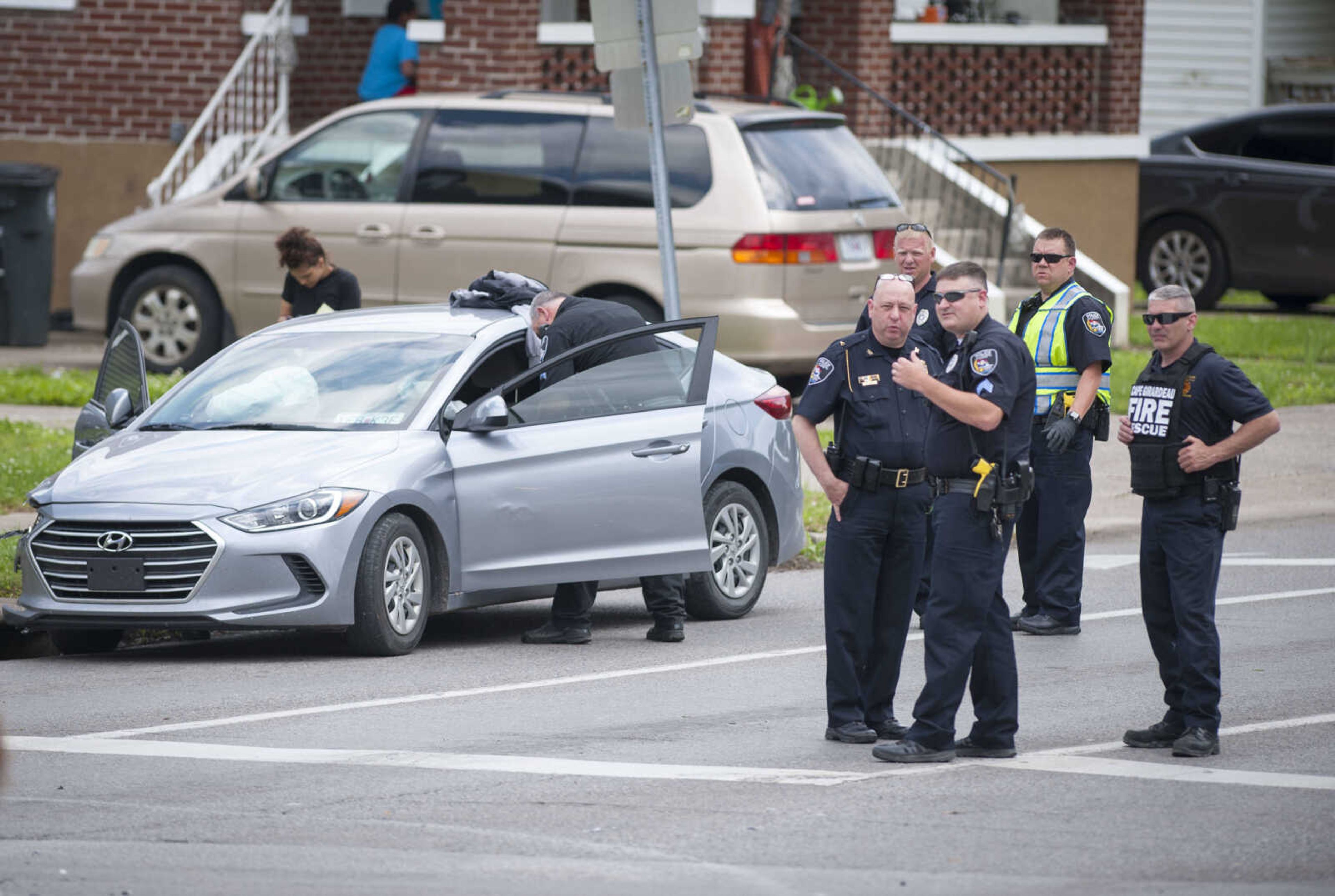 Members of the Cape Girardeau Police Department respond to the scene of a crash near the intersection of William Street and West End Boulevard on Thursday, May 14, 2020. According to Cape Girardeau police Sgt. Joey Hann, both drivers engaged in a verbal altercation. One of the vehicles began to leave the scene as the other driver retrieved a handgun from their vehicle and fired shots at the striking vehicle as it left the scene, Hann stated.