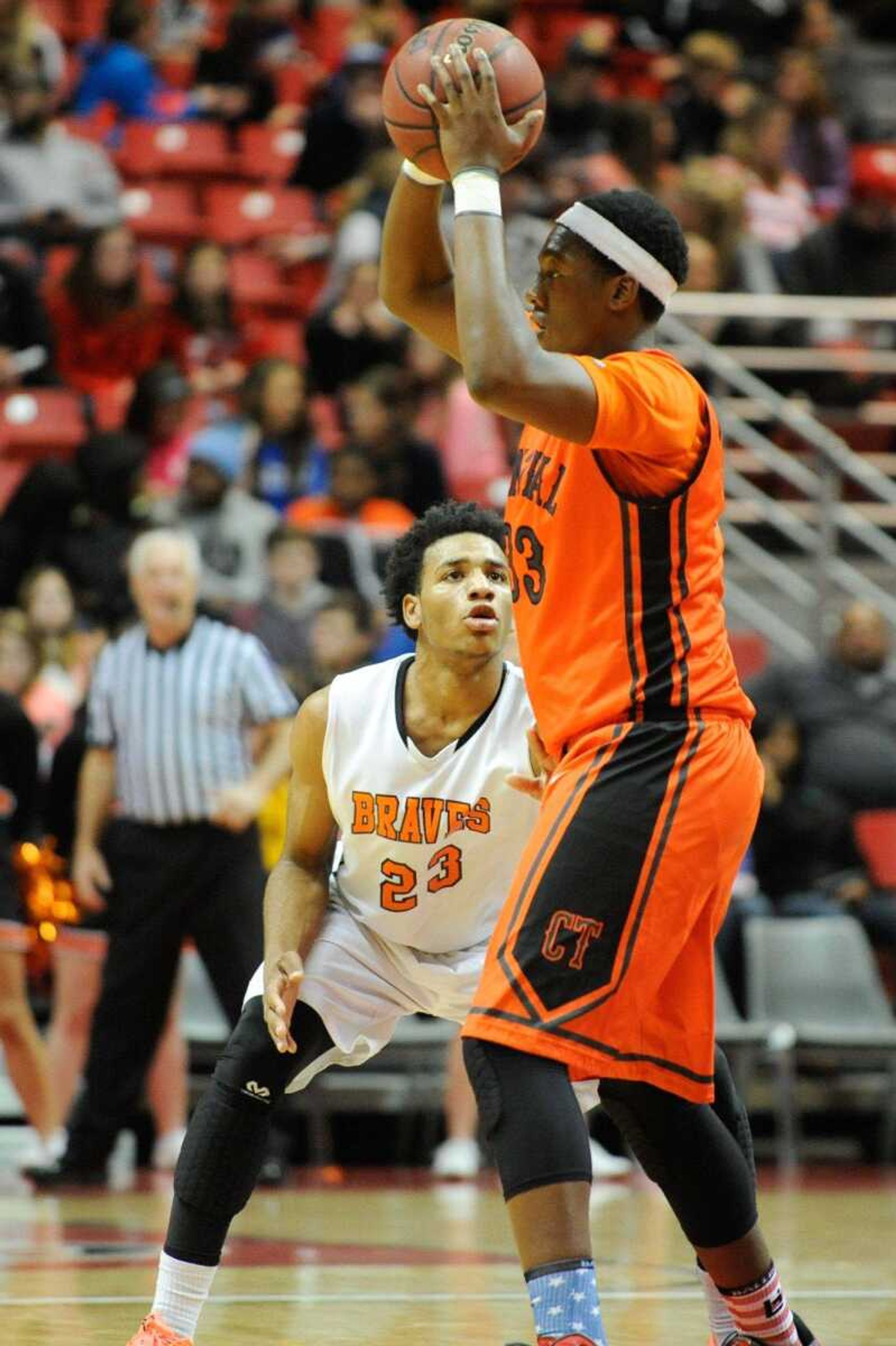 Cape Central's Andre  Statam looks to pass around Scott County Central's Javonta Daniel in the fourth quarter of the third-place game Tuesday, Dec. 30, 2014 during the Southeast Missourian Christmas Tournament at the Show Me Center. (Glenn Landberg)