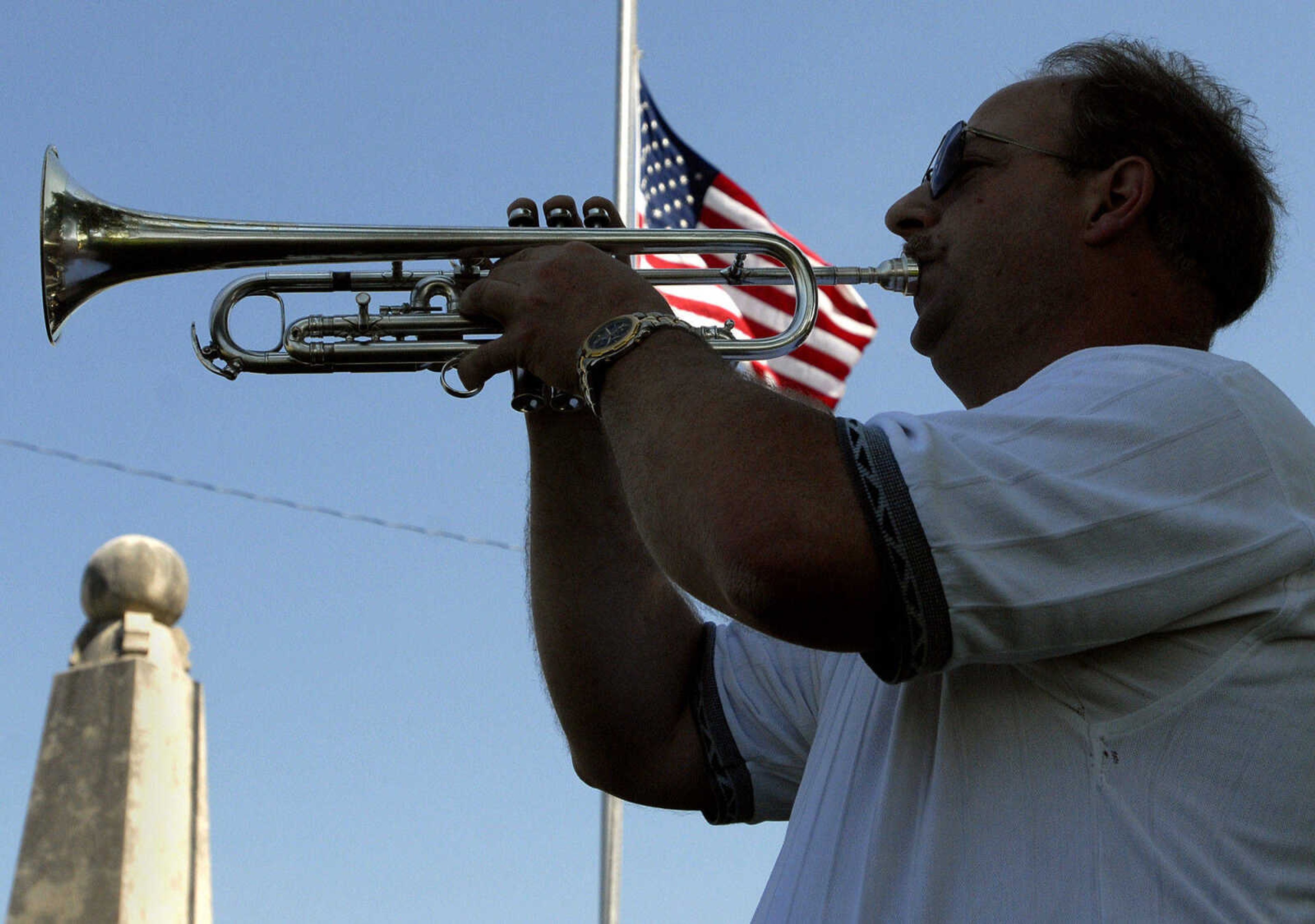 LAURA SIMON~lsimon@semissourian.com
Steve Sebaugh with the Jackson Municipal Band plays the echo of "Taps" during the Memorial Day ceremony Monday, May 30, 2011 in Jackson.