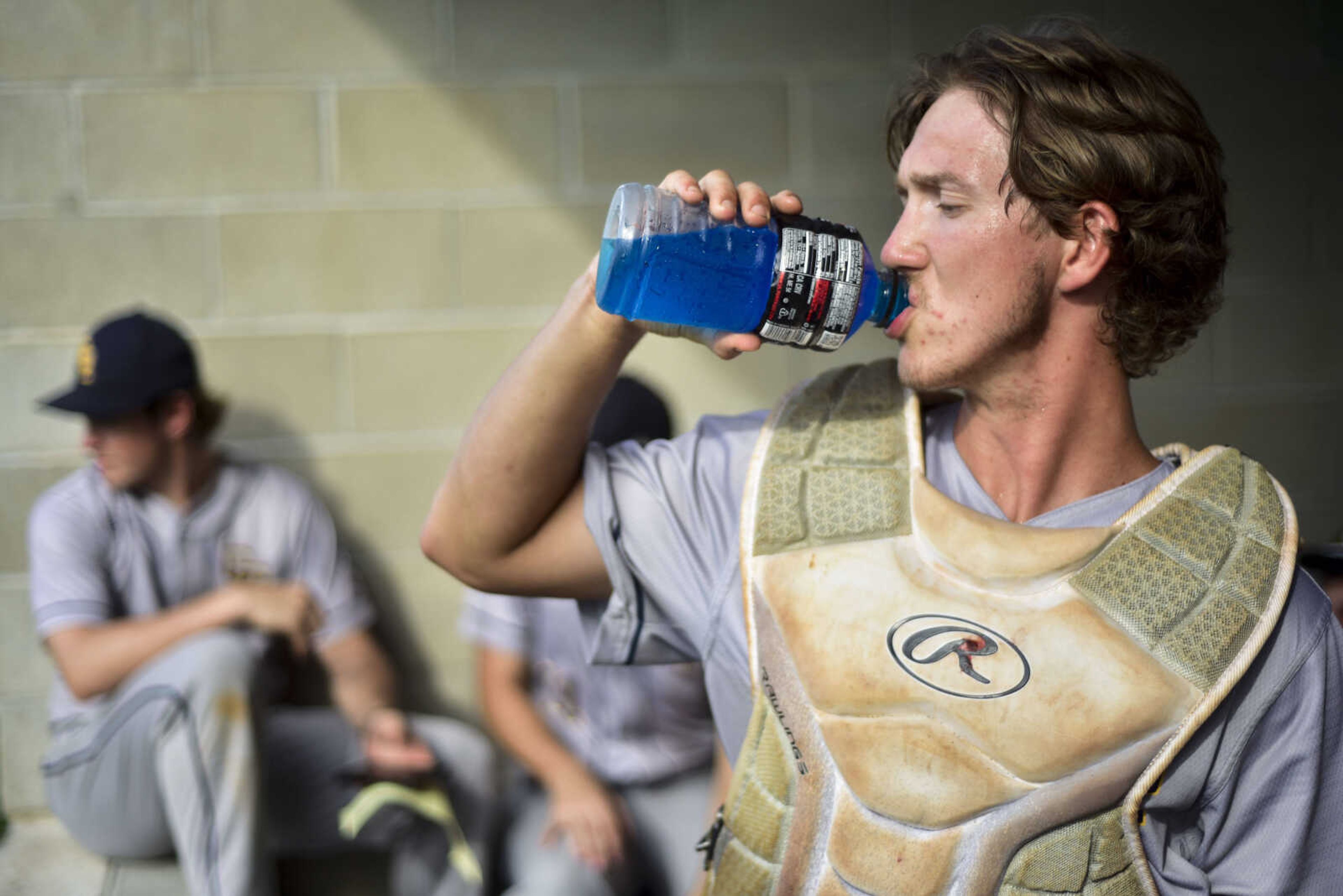 Cape Girardeau Post 63 catcher Trevor Haas takes a drink in the dugout Thursday, July 19, 2018, between innings of a quarterfinal game against Eureka Post 177 during the Senior Legion Zone 4 Tournament at Yanks Field in Ste. Genevieve, Missouri.