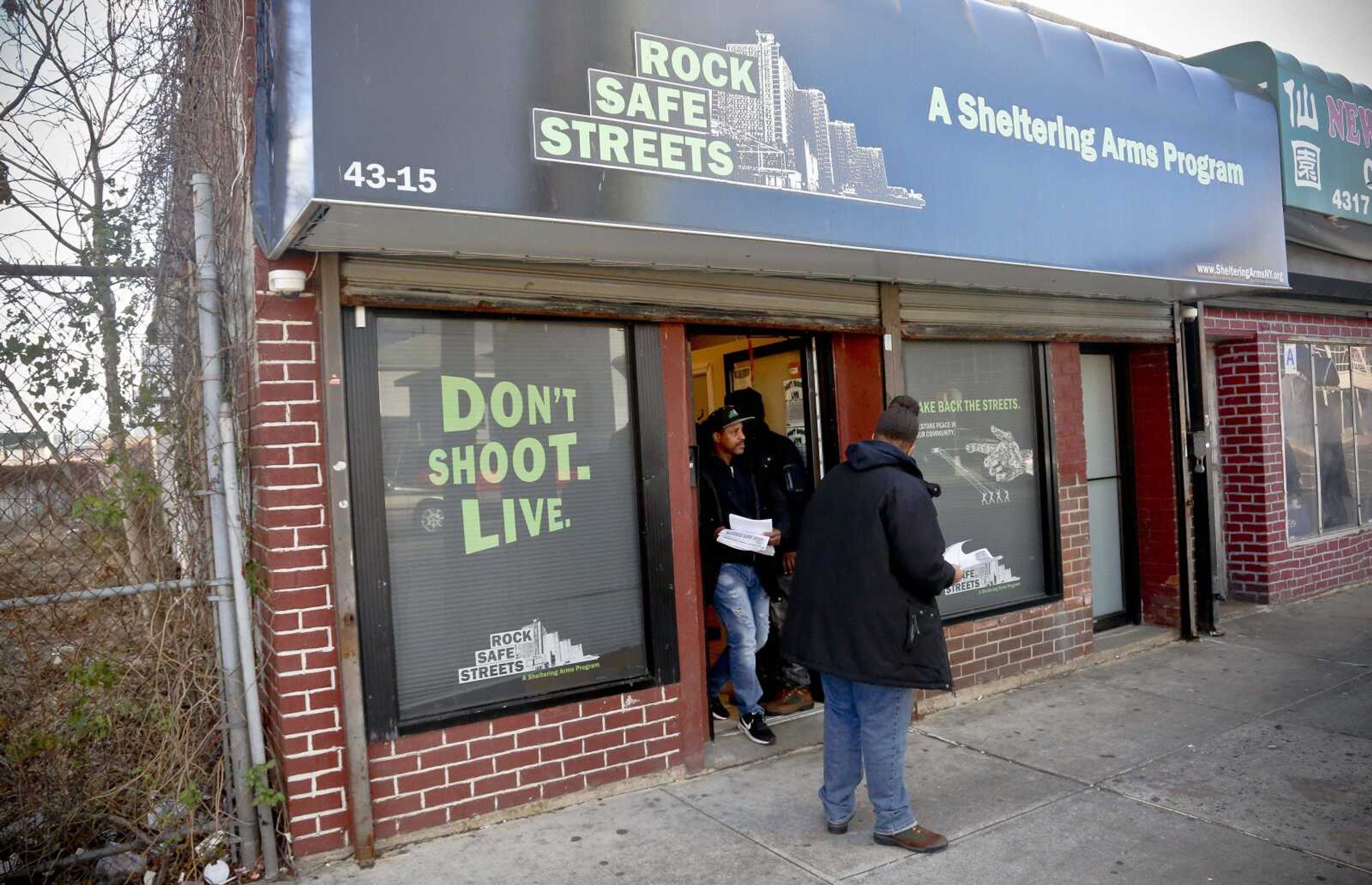 Community outreach workers leave the office of Rock Safe Streets, a gun violence intervention program in Far Rockaway run by the not-for-profit Sheltering Arms, to "get the word" out about their campaigns to stop the violence Friday in New York.