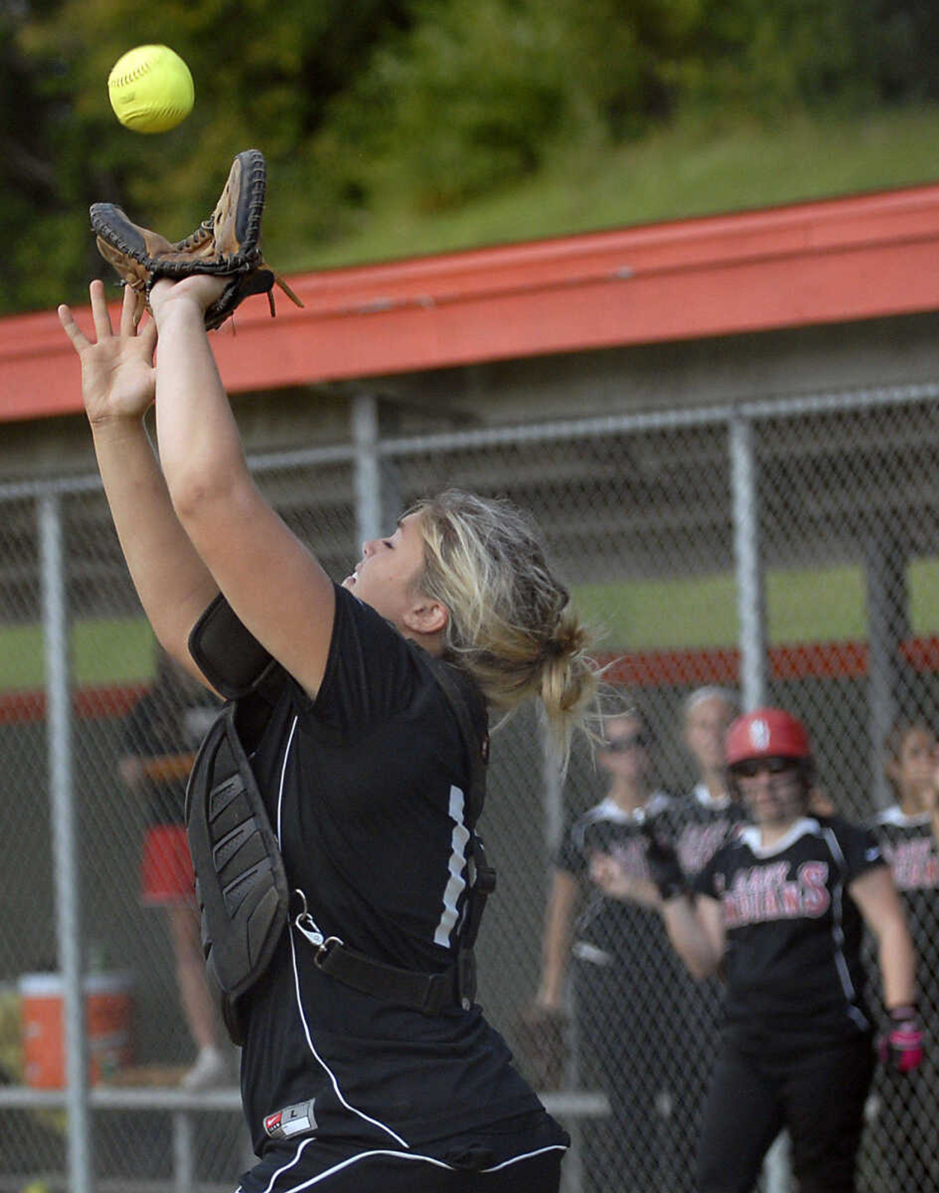 KIT DOYLE ~ kdoyle@semissourian.com
Central catcher Taylre Scott catches a Jackson pop up Wednesday, September 2, 2009, in Cape Girardeau.