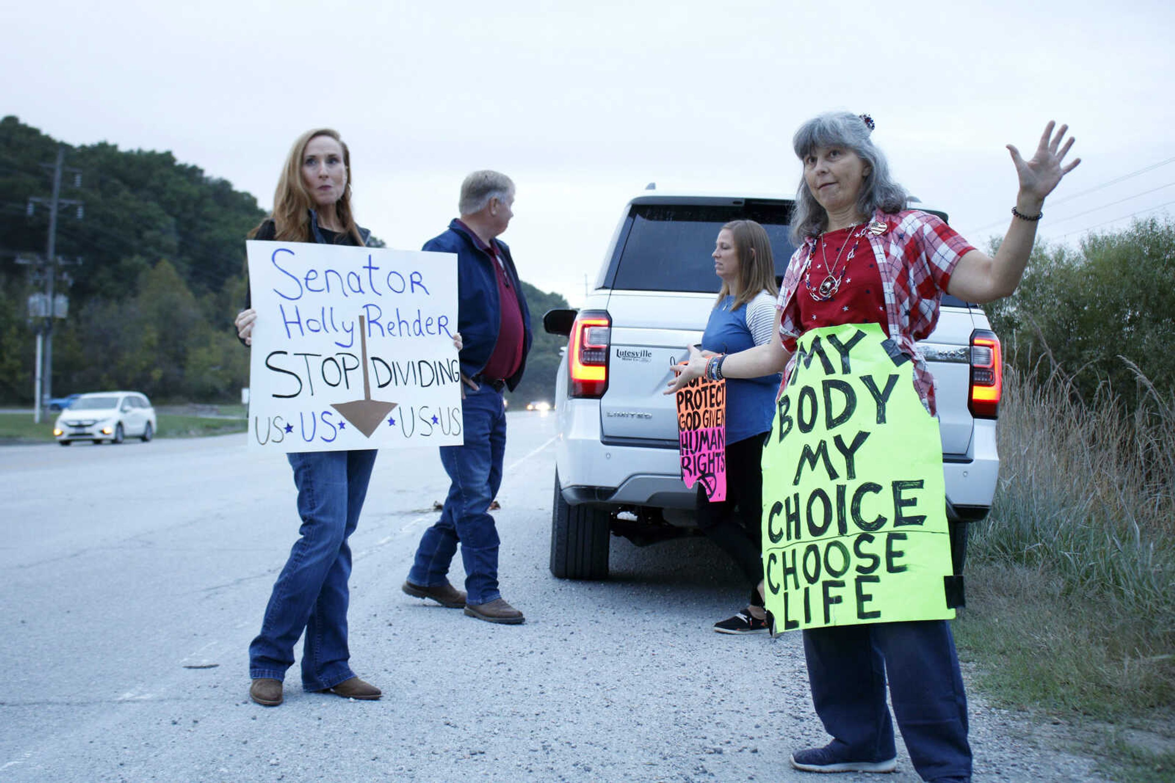 Missouri Sen. Holly Rehder, left, and protester Sara Bohnert, right, stand in solidarity with protesting Procter & Gamble employees Wednesday outside the manufacturer's facility in northeastern Cape Girardeau County.