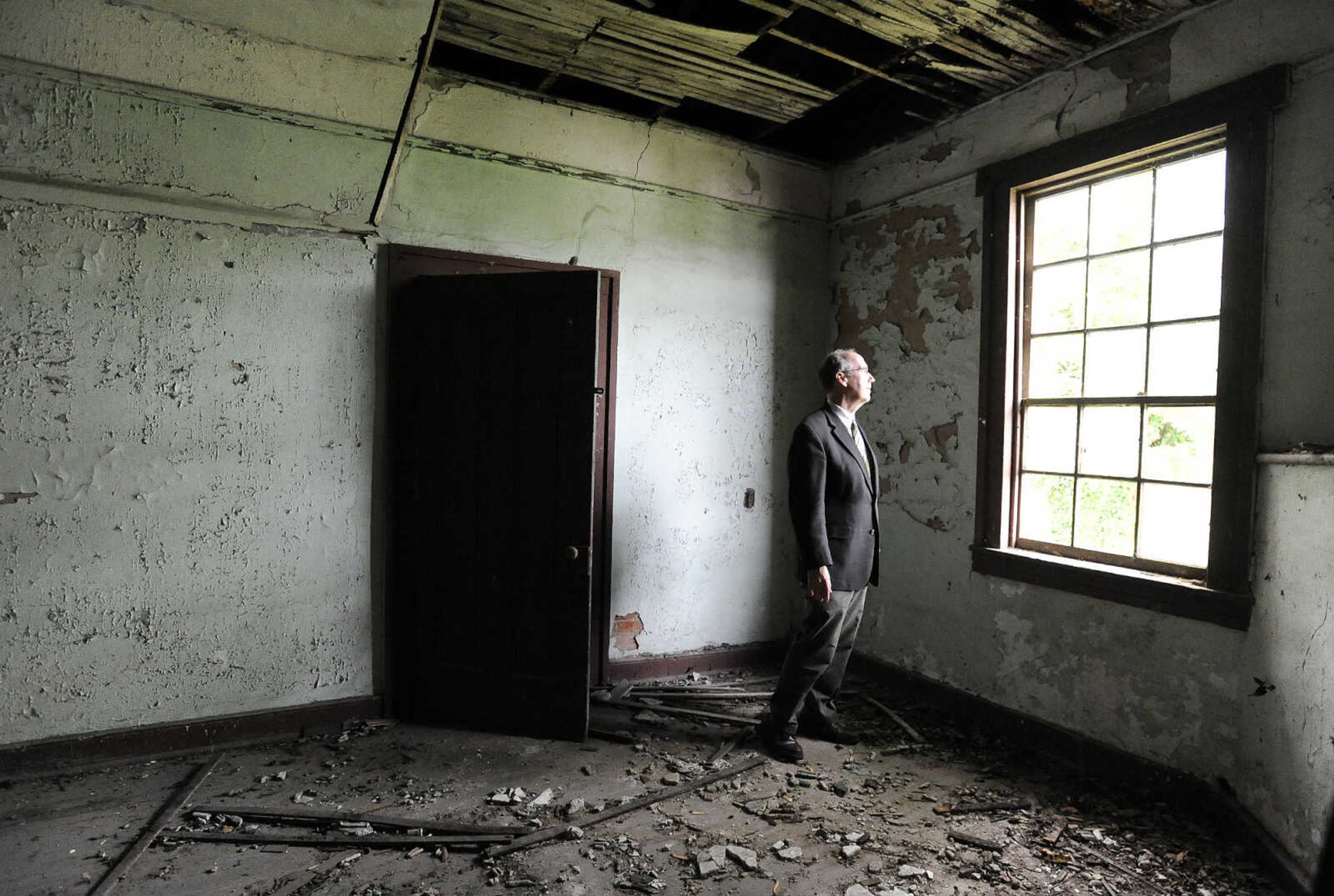 LAURA SIMON ~ lsimon@semissourian.com

Steven Hoffman, coordinator of Southeast Missouri State University's  historic preservation program, stands in a central room of the historic Reynolds House Monday afternoon, May 2, 2016. The Cape Girardeau house, which stands at 623 N. Main Street, was built in 1857.