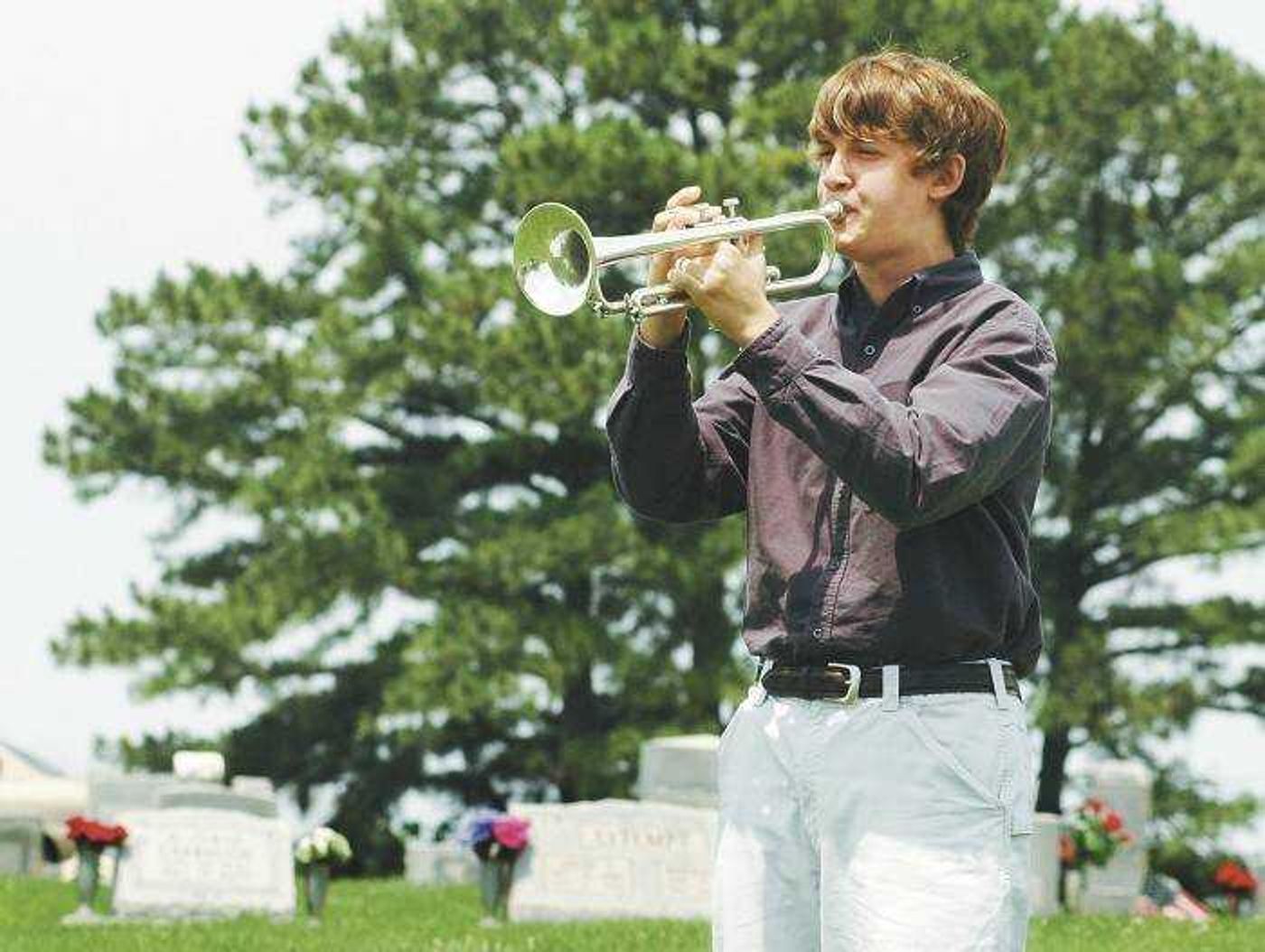 Jacob Azinger, 14, played taps on the trumpet to conclude the Scott City Memorial Day Service on Monday. (Aaron Eisenhauer)