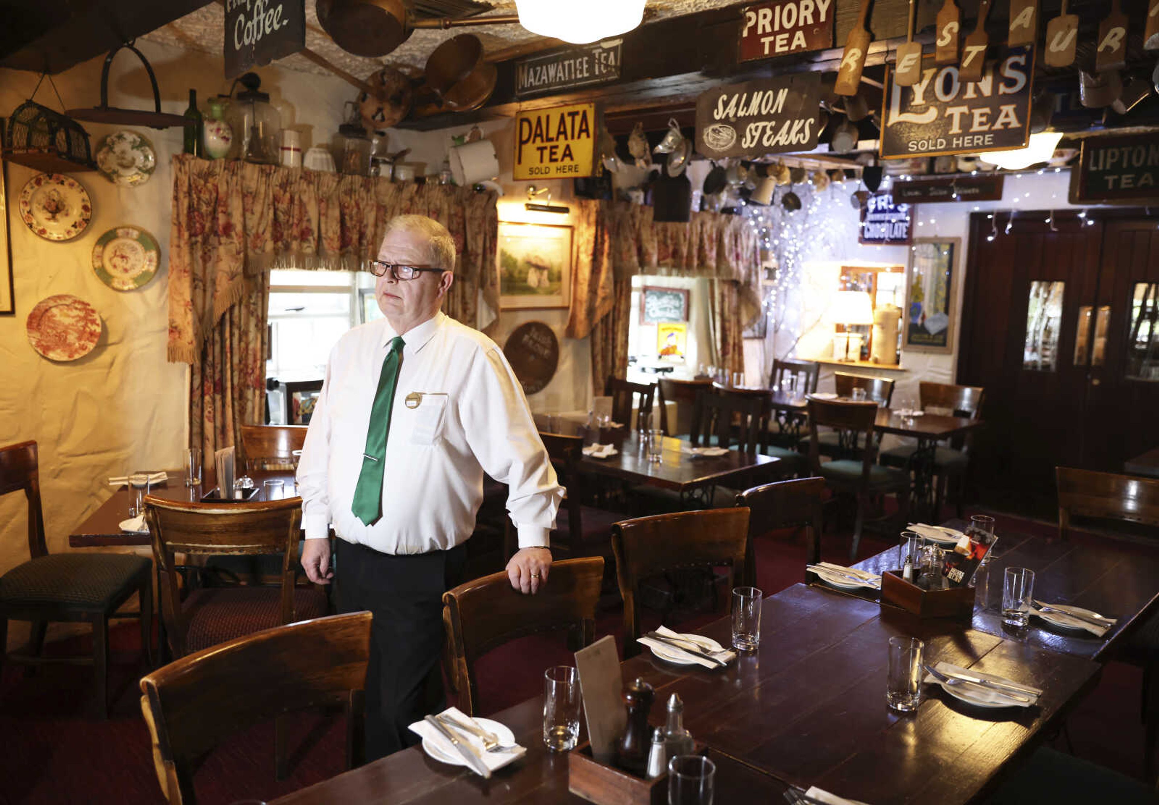 Barman Dominic Fitzpatrick of Fitzpatrick's pub poses for the media in the bar April 5, near the village of Carlingford, Ireland. Fitzpatrick served then-Vice President Biden when he visited the pub in 2016.