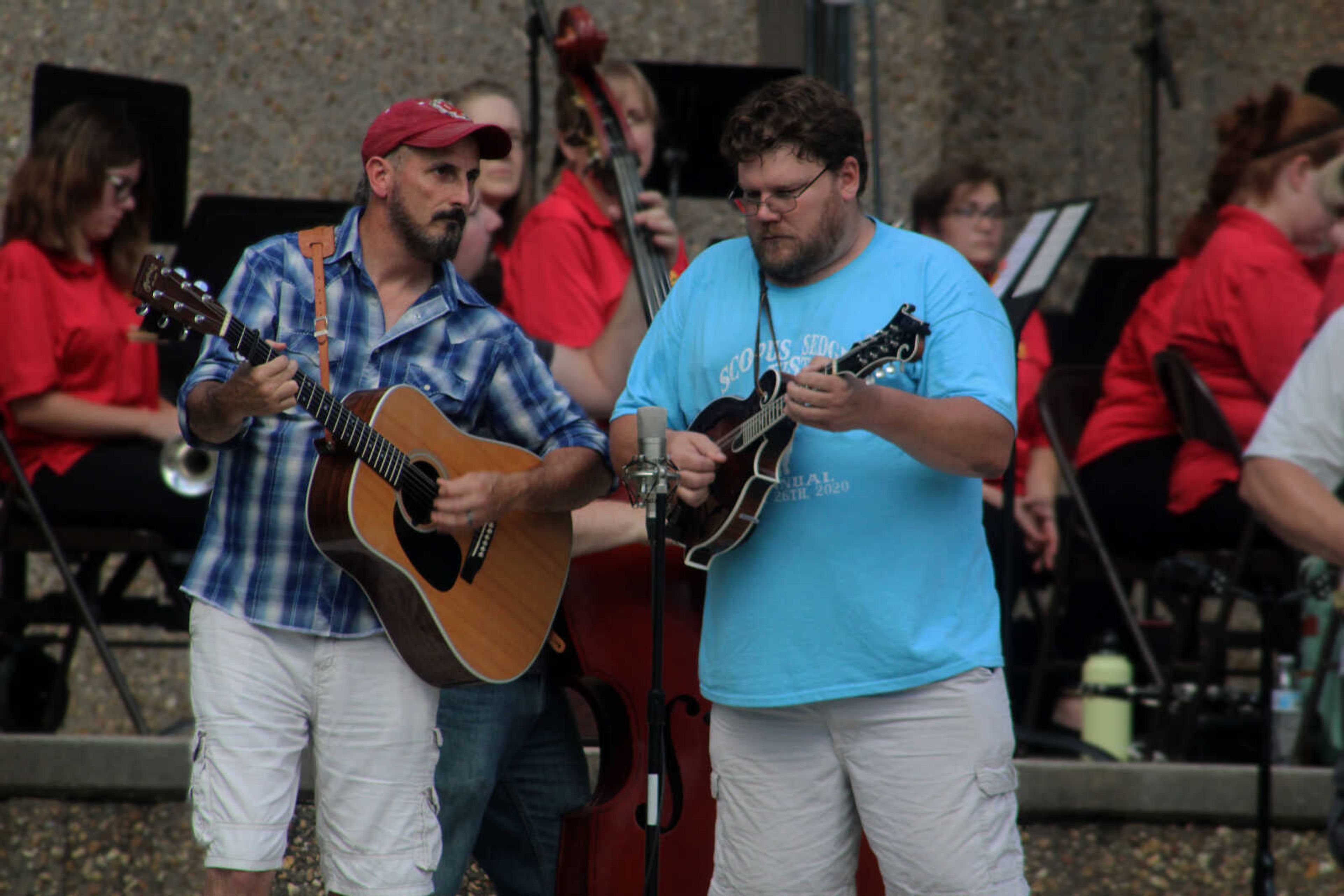 Members of the Whitewater Bluegrass Band perform at the Nick Leist Memorial Bandshell in Jackson City Park on Thursday, July 15, 2021, in Jackson.