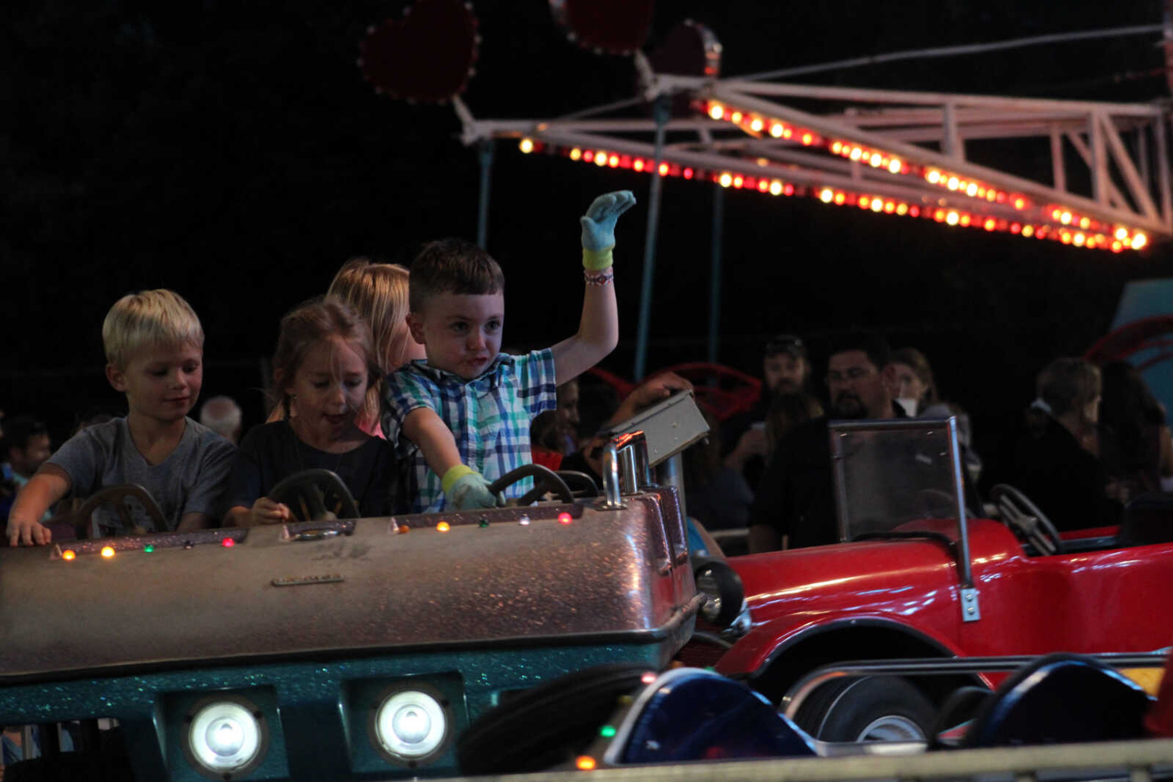 A group of kids ride one of many rides at the East Perry Community Fair Saturday, Sept. 25, 2021, in Altenburg, Missouri.