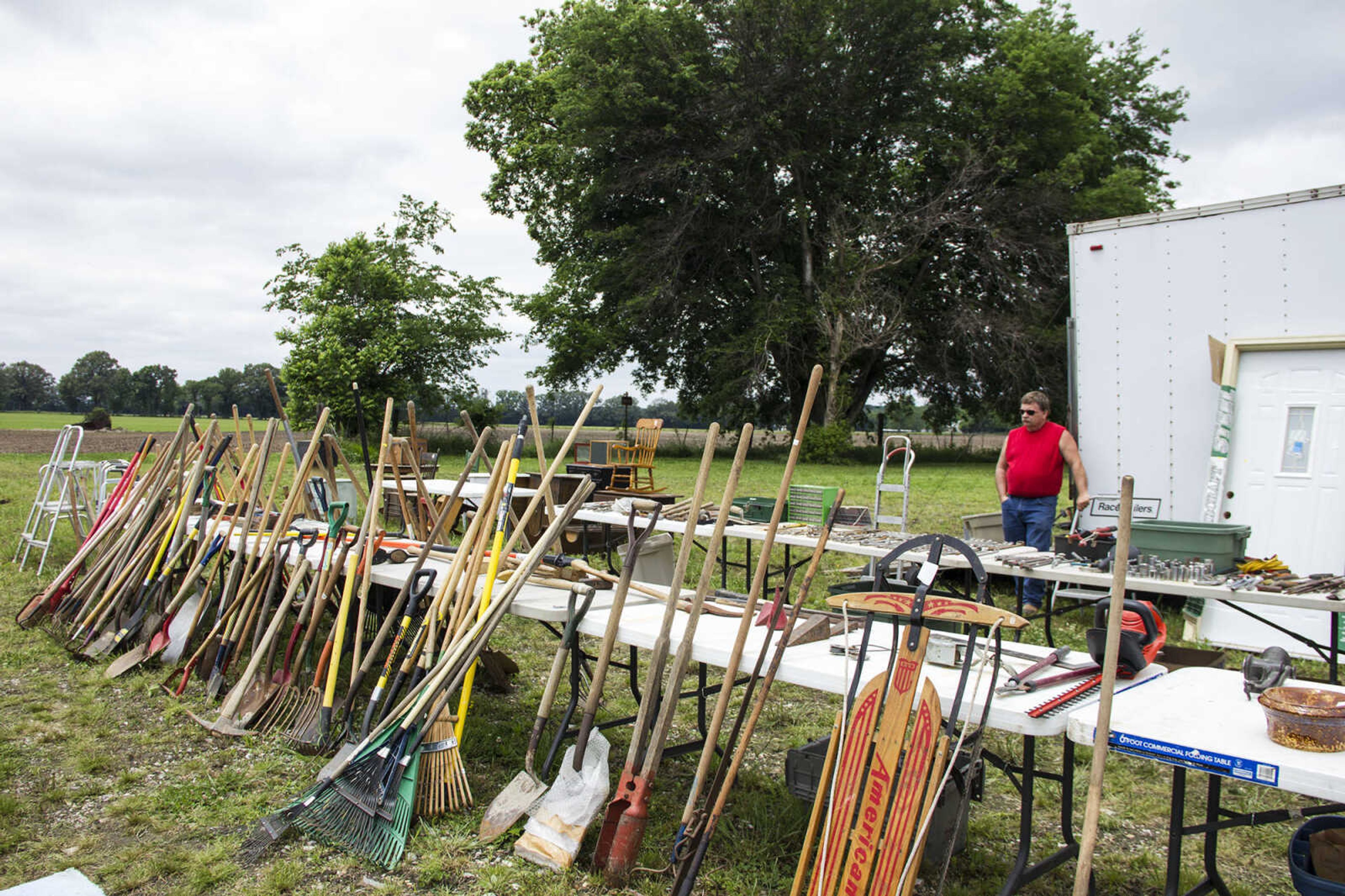 CAROL KELLISON ~ photo@semissourian.com

Gary Sullivan stands behind his mixture of goods at the 100-mile yard sale on Thursday May 22. 2015 in Arbor, Missouri.