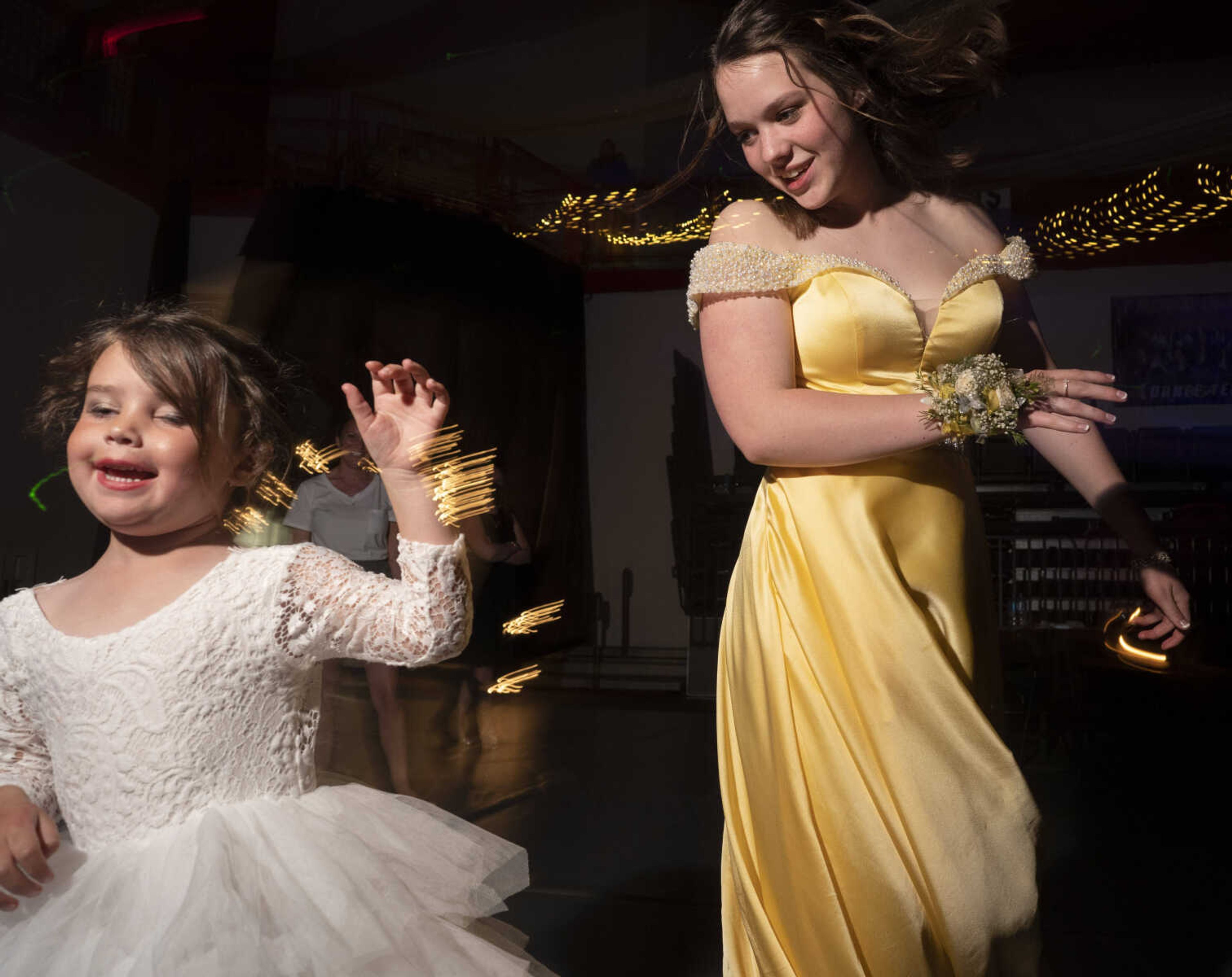 Mariah Gentry, right, dances with Гўв‚¬Е“prom princessГўв‚¬Вќ Colbie Raney, 4, who helped during the coronation ceremony, during prom Saturday, May 1, 2021 at Jackson High School.