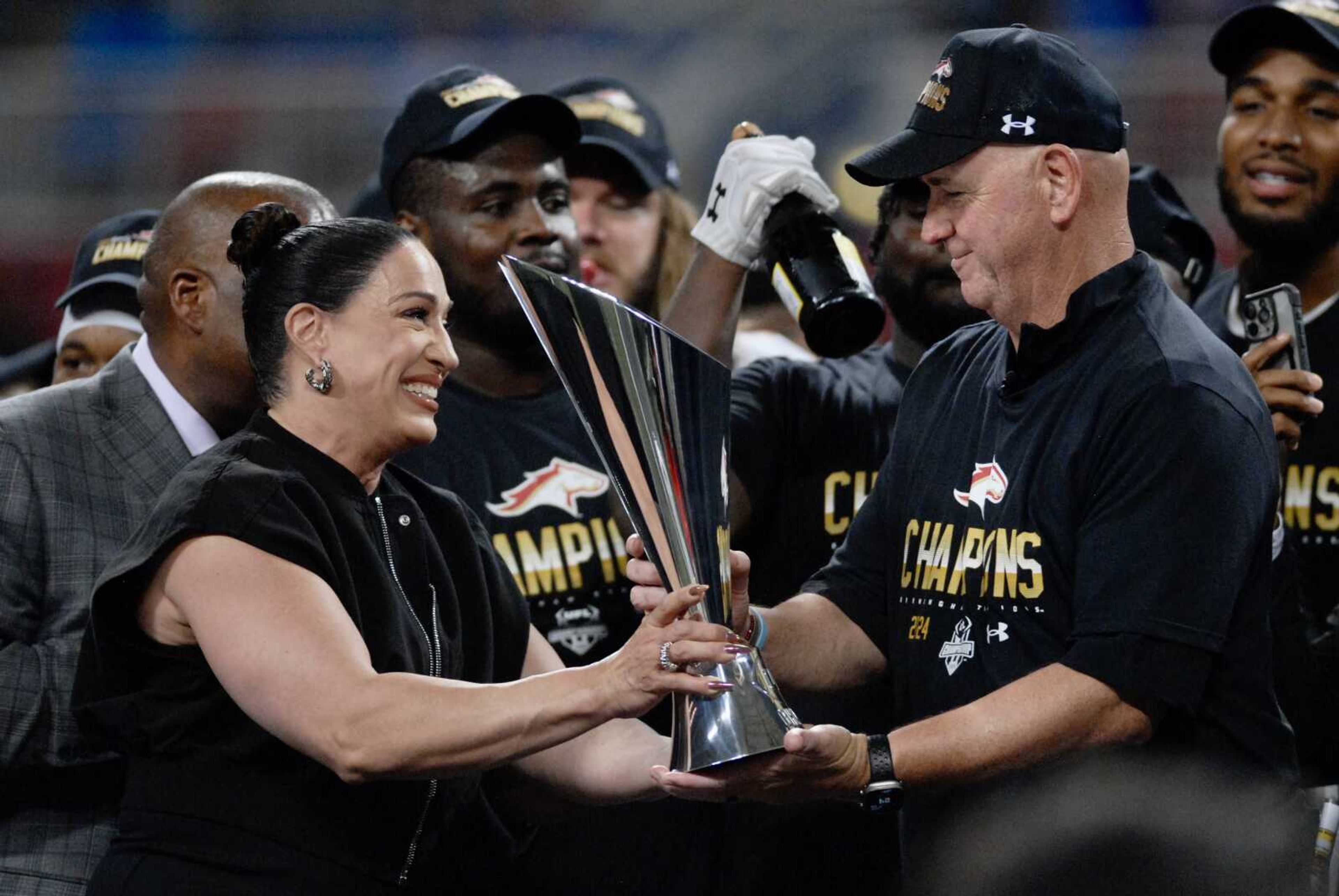 United Football League co-owner Dany Garcia presents the UFL championship trophy to Birmingham Stallions head coach Skip Holtz after the Stallions defeated the San Antonio Brahmas 25-0 in the UFL Championship Game on Sunday, June 16, at the Dome at America�s Center in St. Louis. 