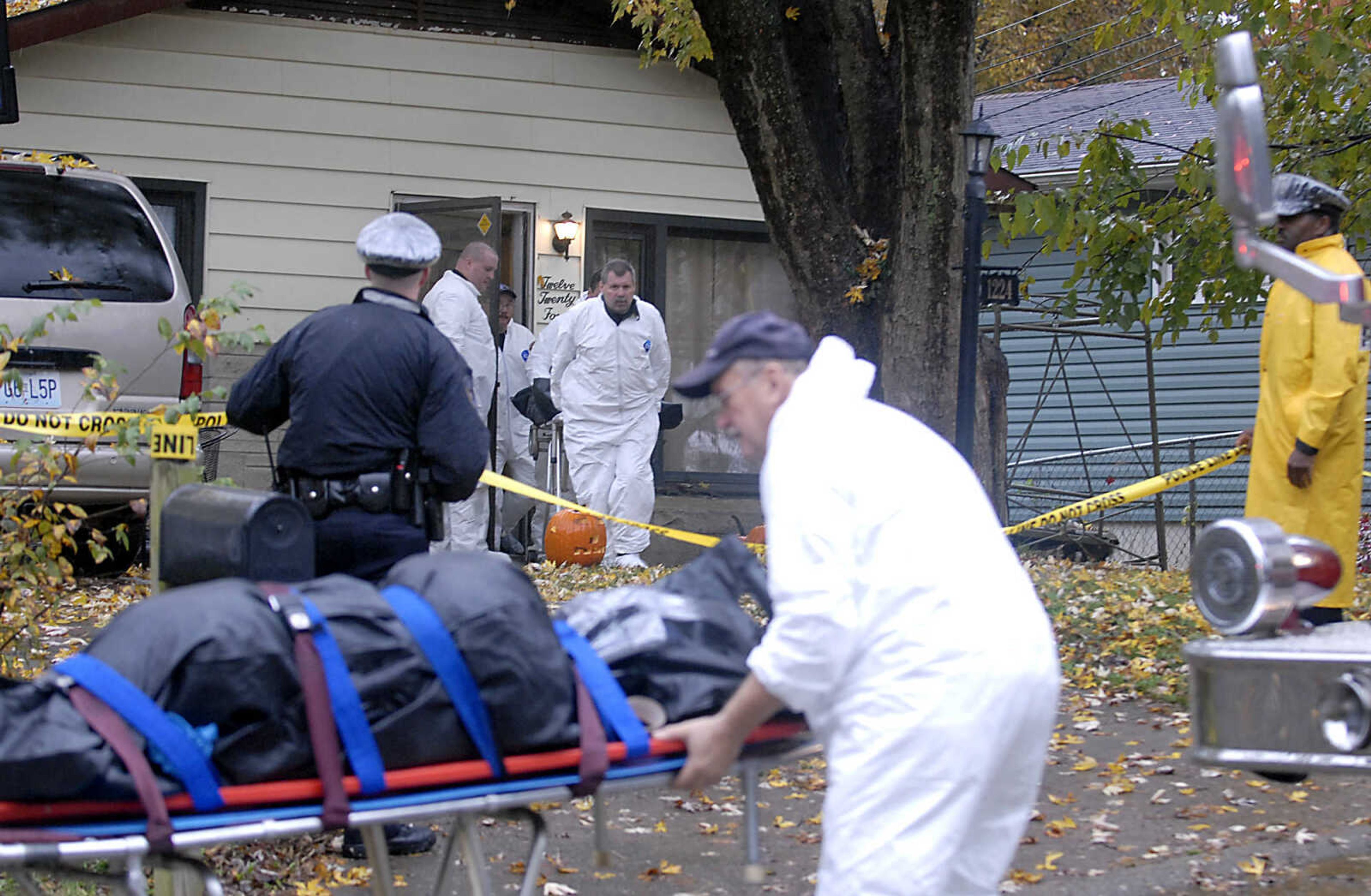 KIT DOYLE ~ kdoyle@semissourian.com
Investigators remove two bodies from 1224 N. Missouri St. and put them in the Coroner's vehicle Tuesday morning, October 27, 2009, in Cape Girardeau.  There was a double homicide at the residence early Tuesday morning.