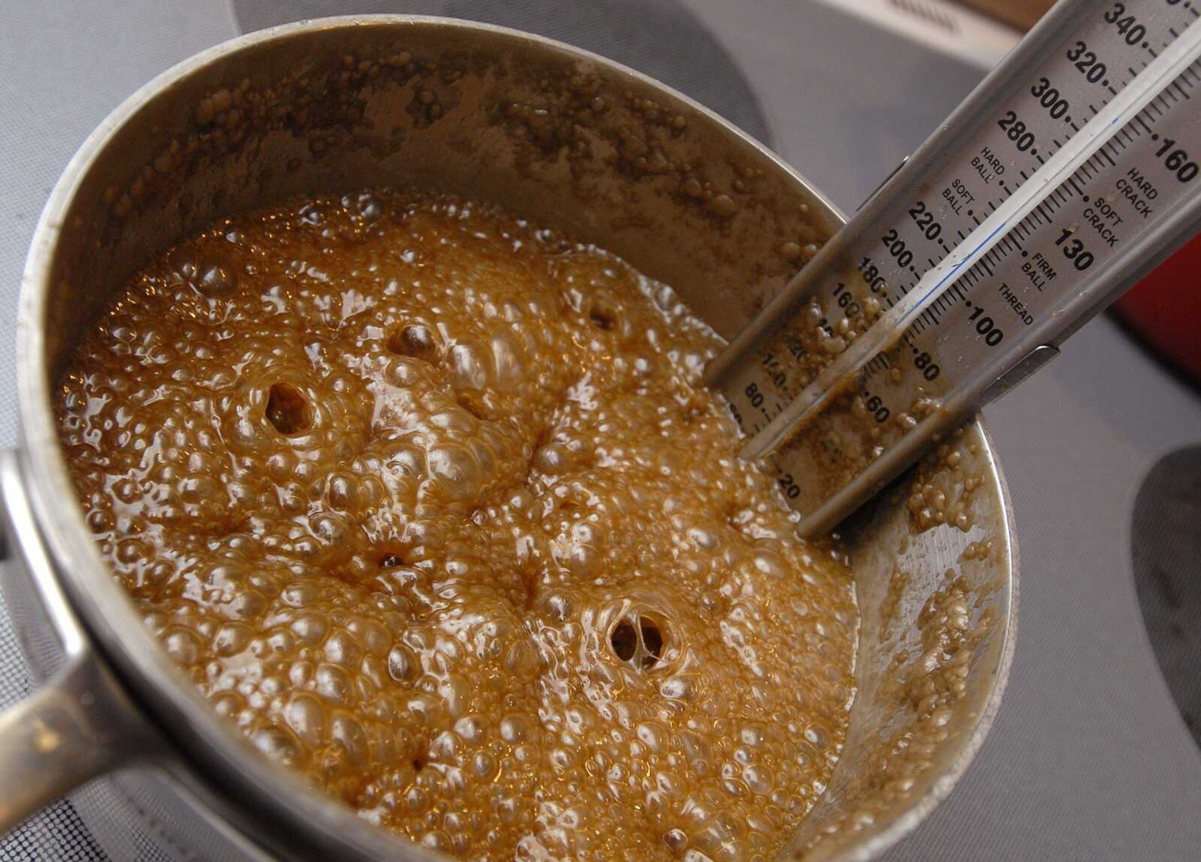 The caramel mixture is made by boiling sugar, bourbon, corn syrup and cream to a temperature of 250 degrees. (Fred Lynch)