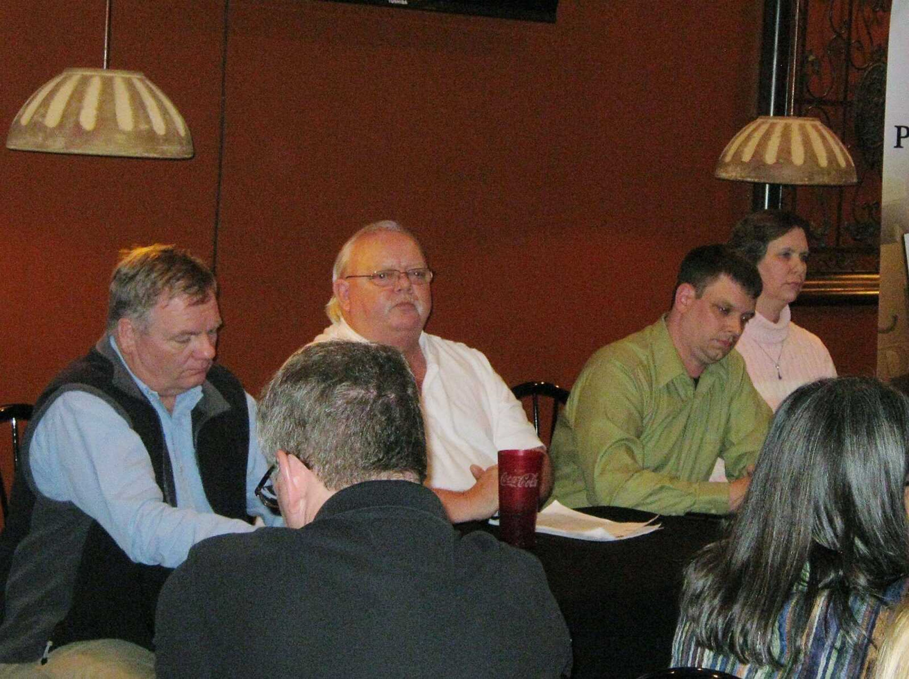 Cape Police Department Lt. Barry Hovis, left, a life member of the NRA; Jeff Poole, owner of Absolute Arms and Ammo in Cape Girardeau; Jake Ruebel, a concealed-carry instructor, and Heidi Holland, the Sporting Goods Department Manager at a local Walmart participate in a panel discussion on gun safety, gun legislation and second amendment rights sponsored by the Southeast Missouri Pachyderm Club Thursday, March 7, at Dexter Bar-B-Que in Cape Girardeau. (SAMANTHA RINEHART)