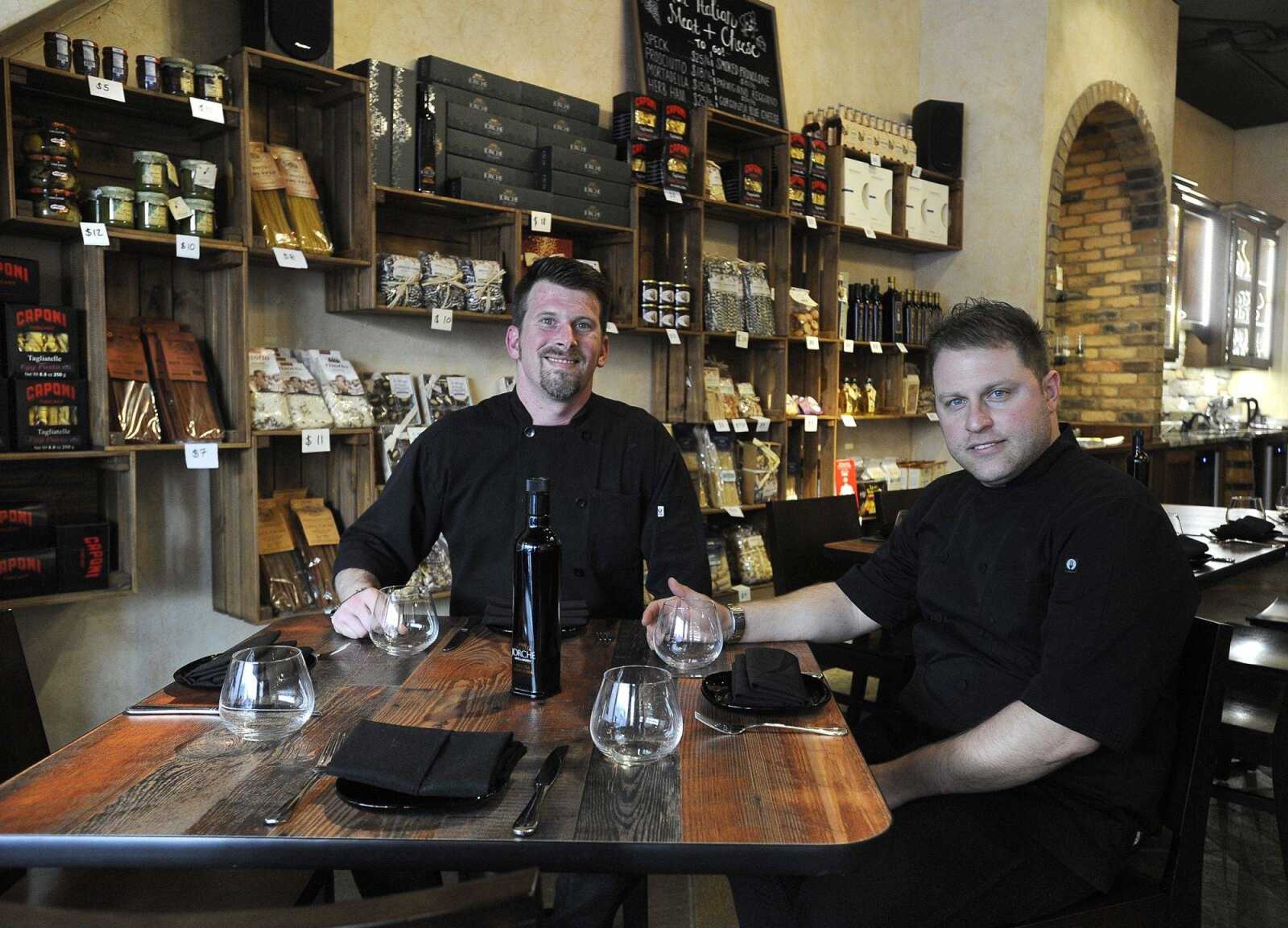 Jeremy Bourland, left, and Gabriele Ruggieri pose for a photo in the dining area Friday at Gabriel's Food + Wine, 127 N. Main St. in Cape Girardeau.