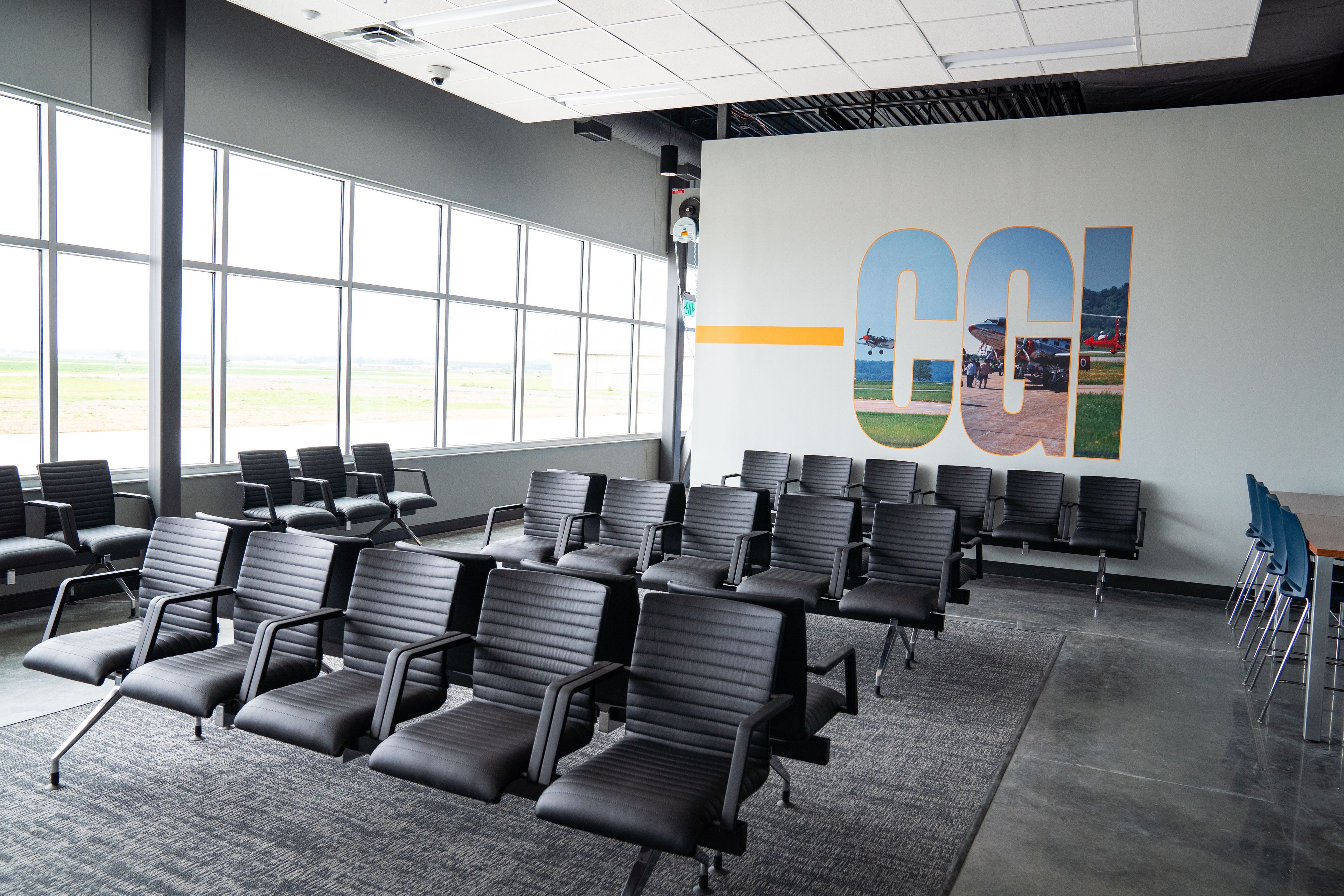 The new gates for the Cape Girardeau Regional Airport give a view of the runways with large windows allowing the room to fill with natural light on Wednesday, Aug. 14 in the new terminal. Airport manager Katrina Amos designed the CGI design above the seats.