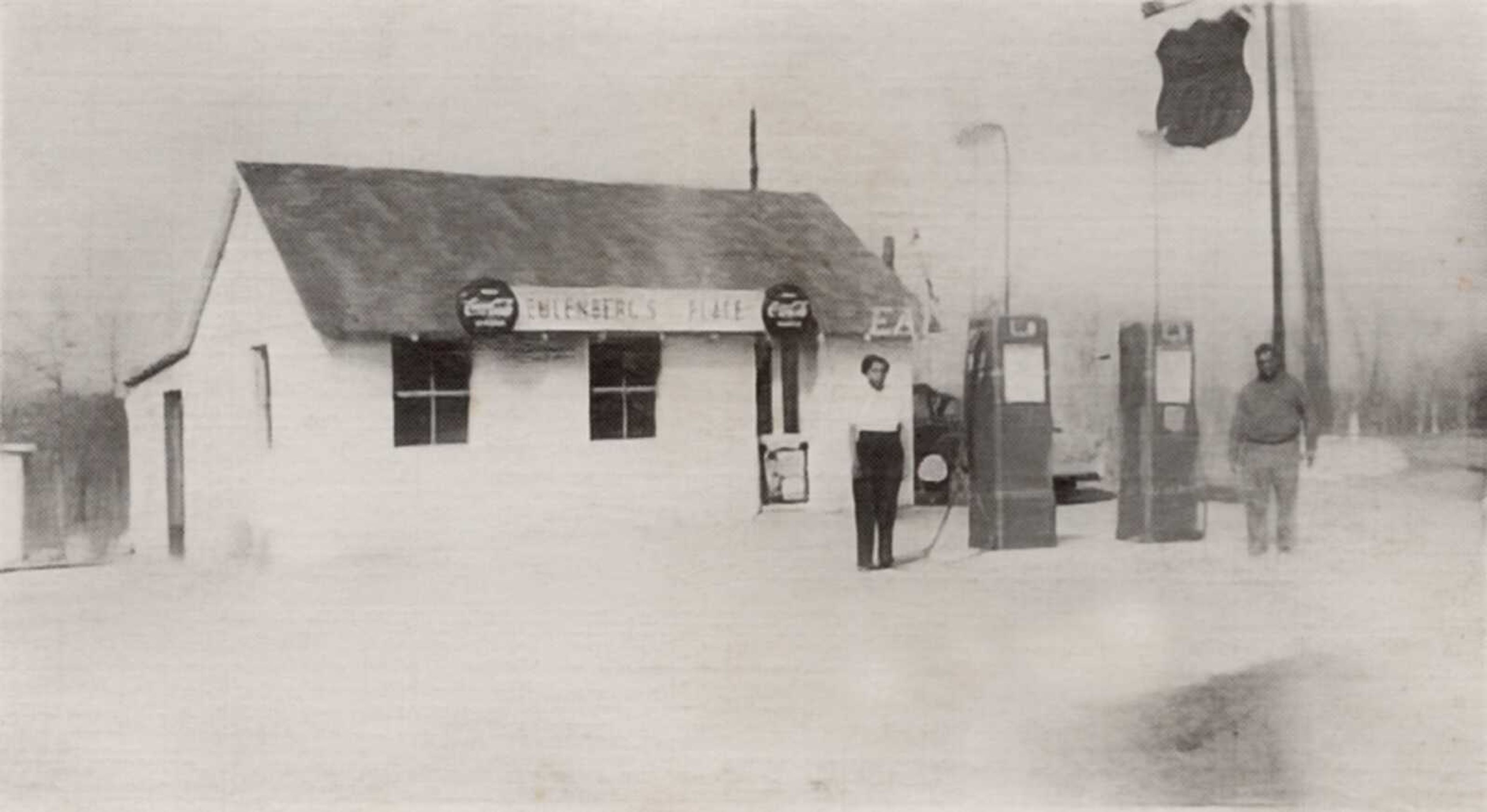 Along with business cards, Eulinberg's Place also was listed in 1961-64 editions of "The Traveler's Green Book, Guide for Travel & Vacations". The Green Book guided Black travelers to safe and accommodating places to eat, buy gasoline, and lodging while traveling. Standing in front of Eulinberg's Place are Bessie and Shannon Eulinberg.