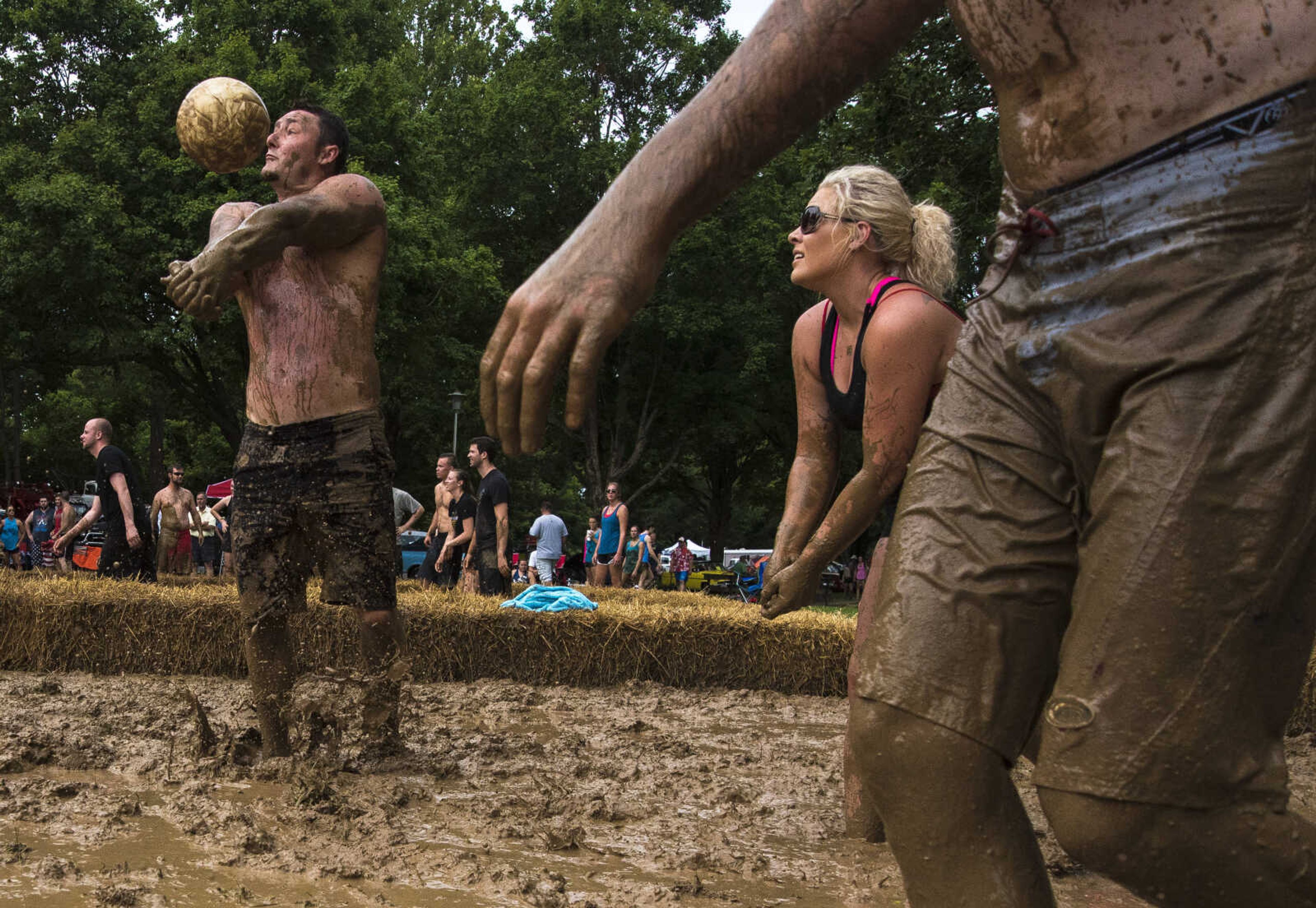 Joey Weaver hits the ball during mud volleyball for the Jackson Parks and Recreation's July 4th celebration Tuesday, July 4, 2017 in Jackson City Park.