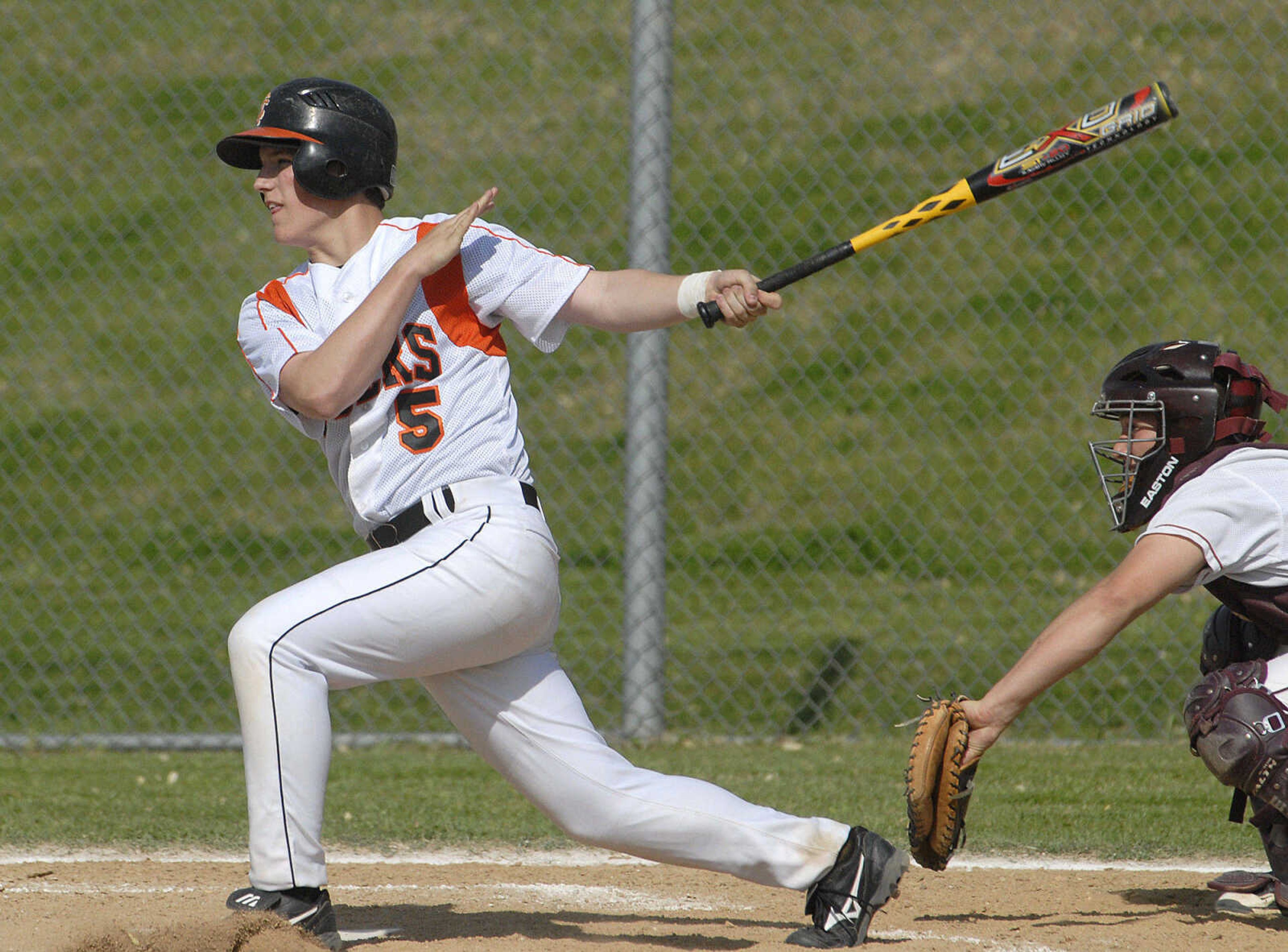 Central's Ryan Grigaitis doubles in a run against Poplar Bluff in the first inning Friday at Central High School.