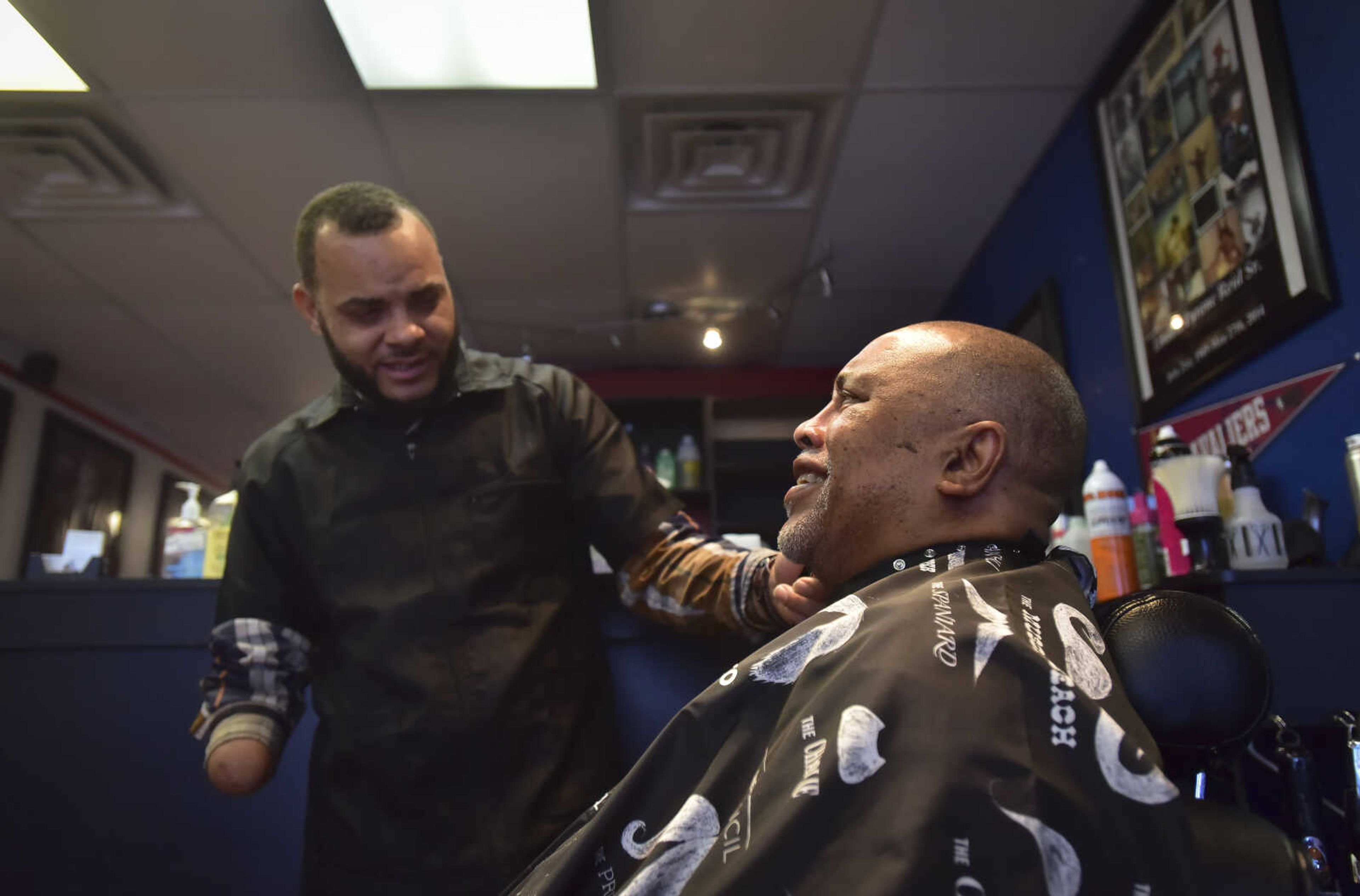 David Stewart gets a haircut by Chuck Reid at The Shop Friday, Jan. 6, 2017 at 821 Broadway in Cape Girardeau.