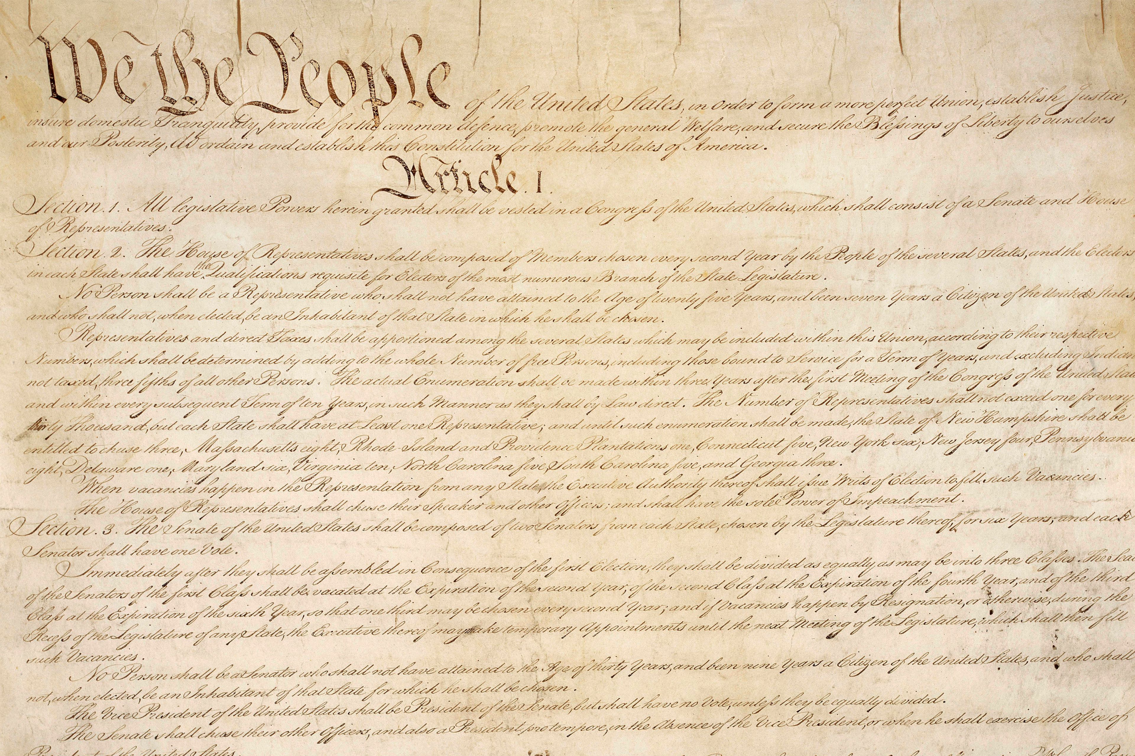 FILE - This photo made available by the U.S. National Archives shows a portion of the first page of the United States Constitution. (National Archives via AP, File)