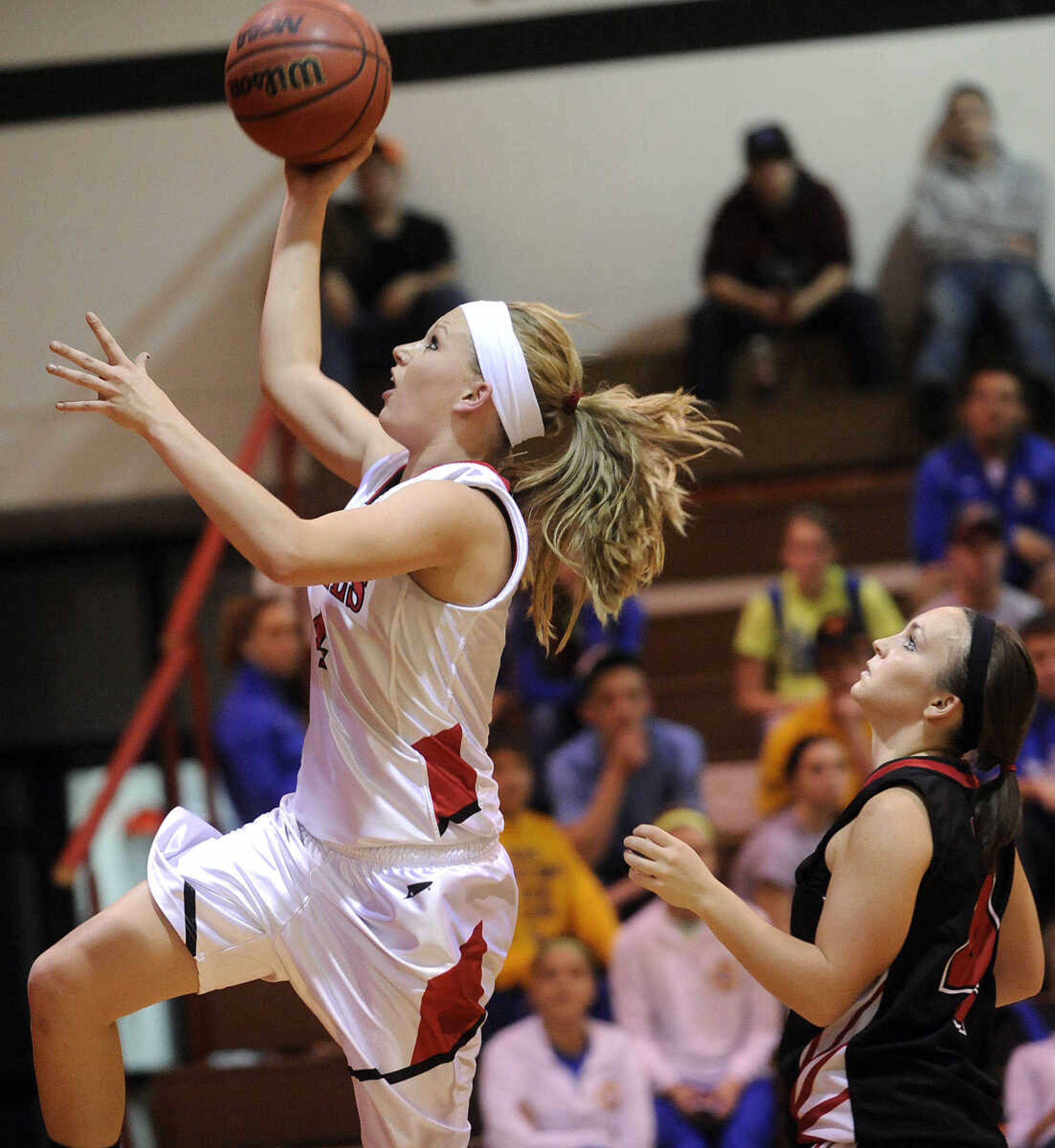 Woodland's Josie Long goes up for a shot as Chaffee's Adrienne Eichhorn looks on during the second quarter of the Lady Devils Invitational championship game Saturday, Dec. 8, 2012 in Chaffee, Mo. (Fred Lynch)