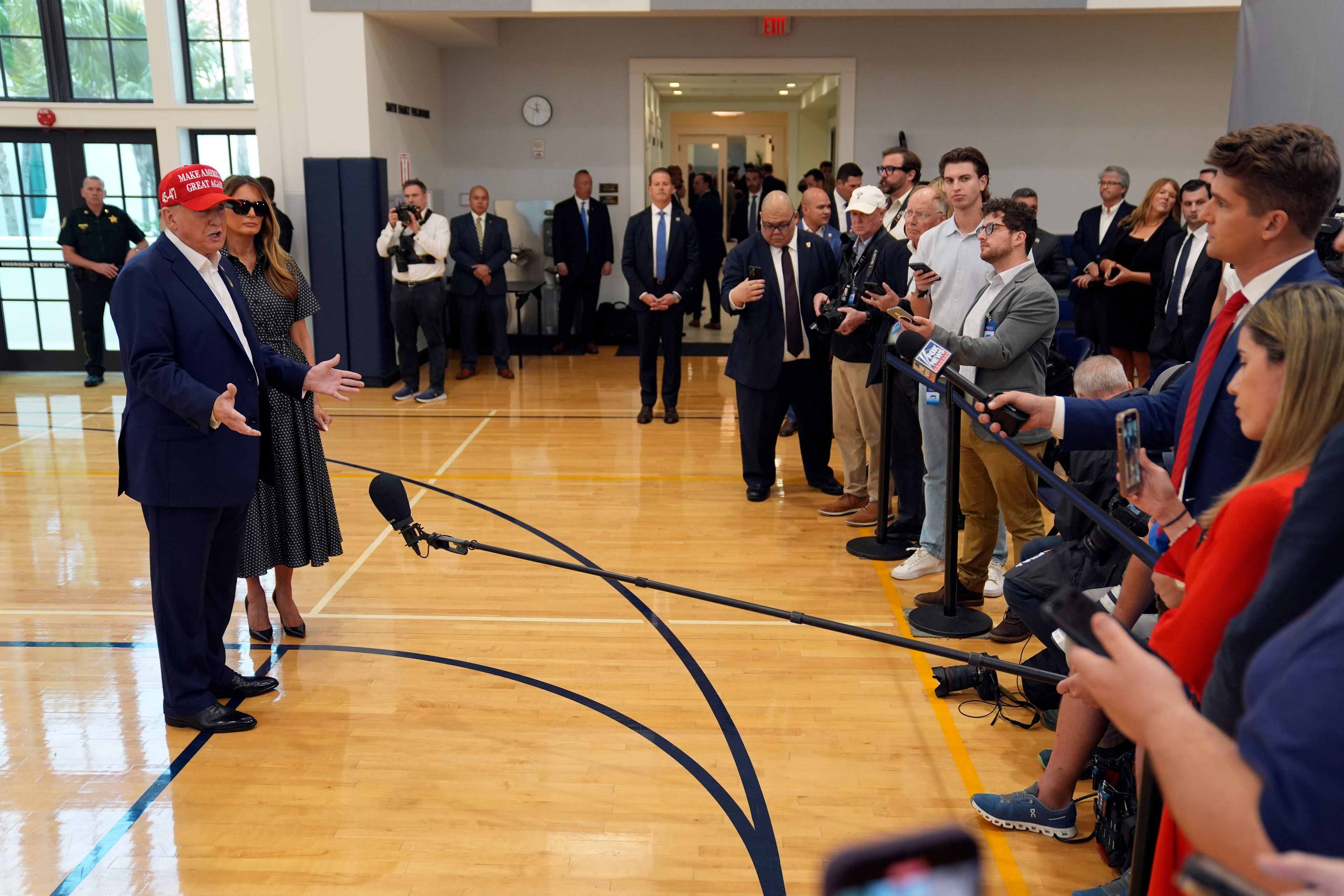 Republican presidential nominee former President Donald Trump speaks as former first lady Melania Trump listens after they voted on Election Day at the Morton and Barbara Mandel Recreation Center, Tuesday, Nov. 5, 2024, in Palm Beach, Fla. (AP Photo/Evan Vucci)