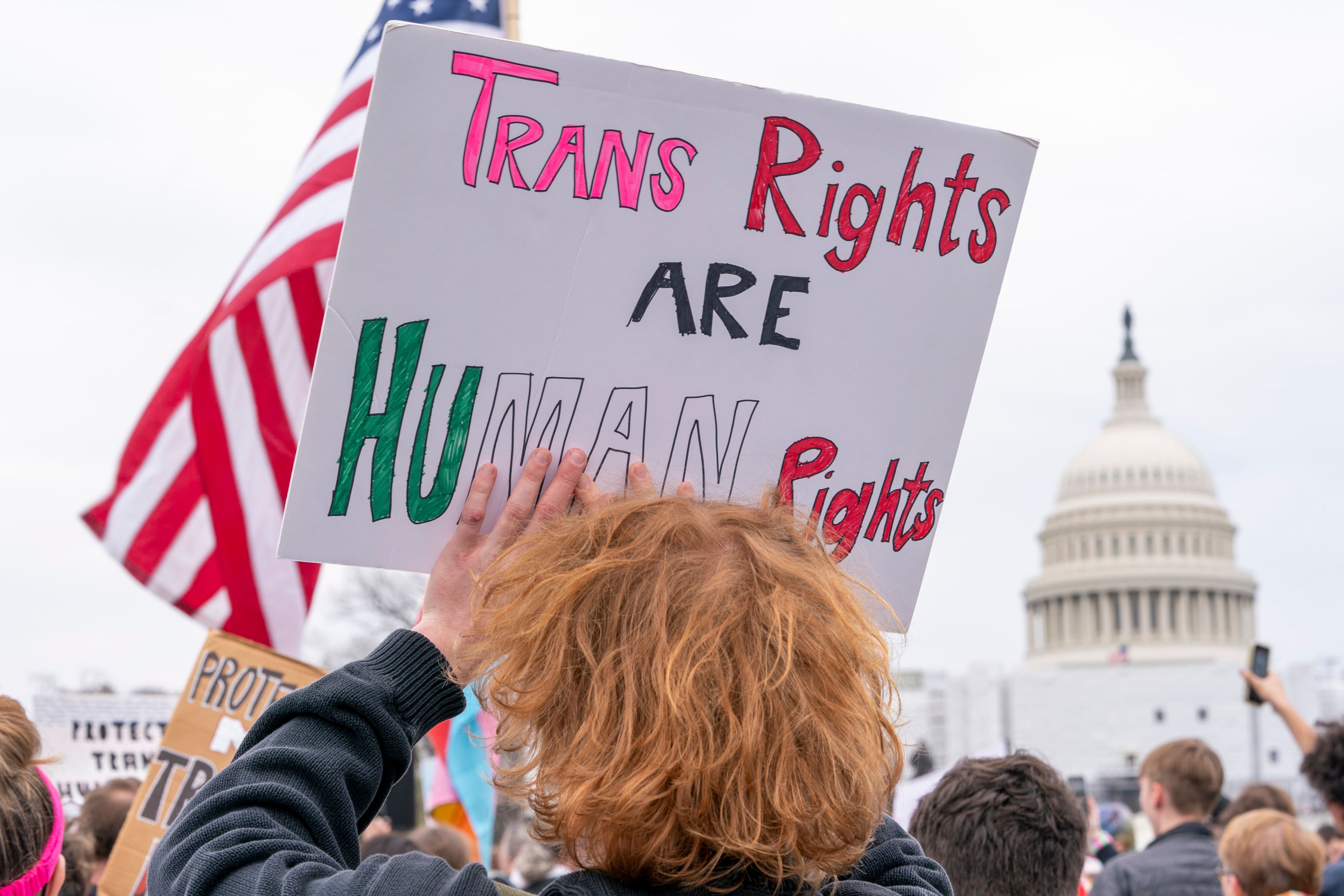 FILE - People attend a rally as part of a Transgender Day of Visibility, Friday, March 31, 2023, by the Capitol in Washington. (AP Photo/Jacquelyn Martin, File)