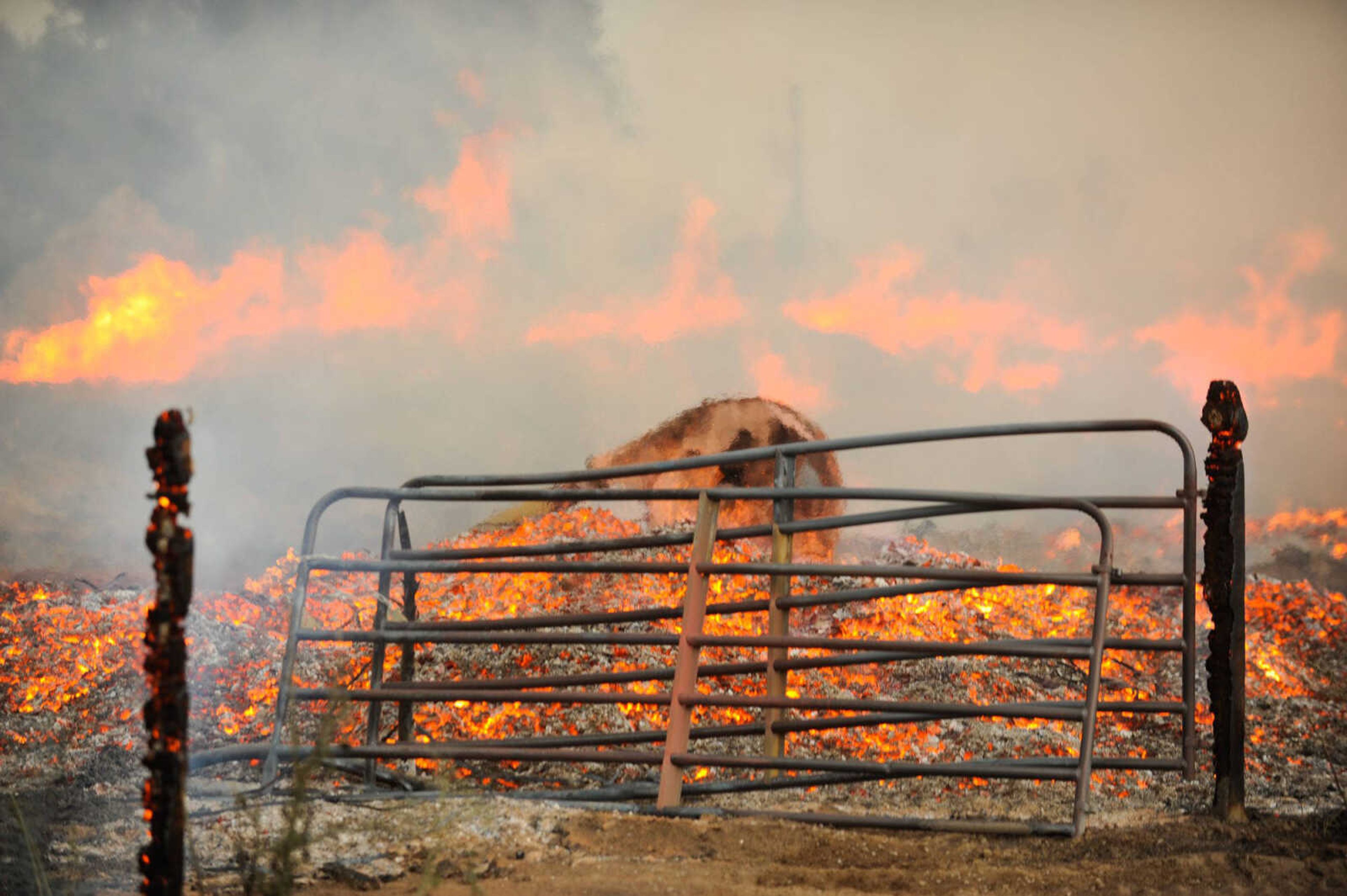 Several area fire departments work to extinguish a blaze Friday at Pallet Connections on Route H in Scott County. (Glenn Landberg)