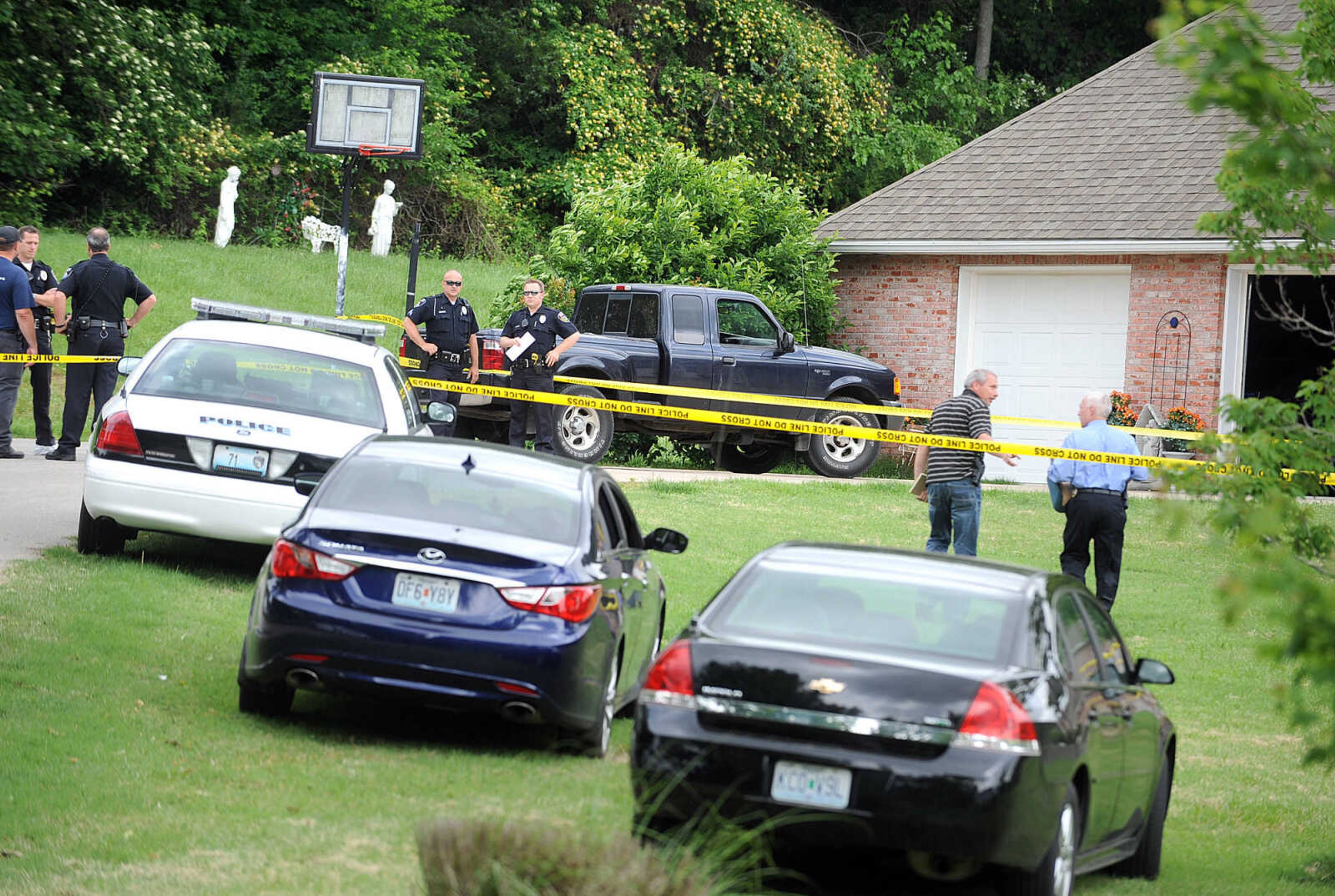 LAURA SIMON ~ lsimon@semissourian.com

Members of the Cape Girardeau Police Department work the scene of a morning shooting at 1220 W. Cape Rock Drive,Thursday, May 30, 2013. Two people, 18-year-old Matthew Joseph and 57-year-old Mary Joseph died from gunshot wounds. George Joseph, 48, has been arrested for the murders of his wife and son.