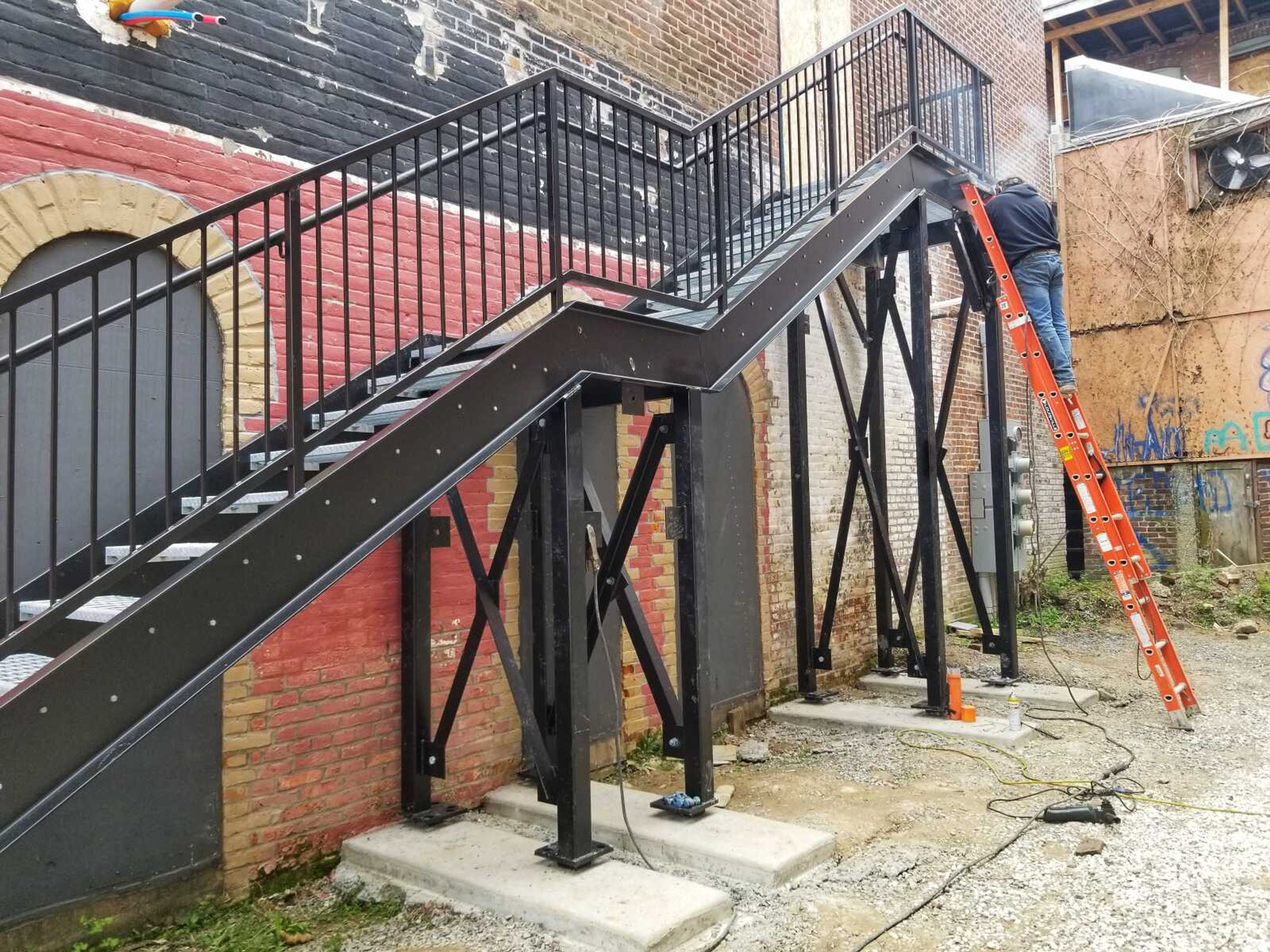 A workman installs new stairs Thursday to the second floor above Bon Bon's Bakery & Cafe, 125 N. Water St. in downtown Cape Girardeau. Le Lounge by Bon Bon's will open May 18, according to owner Stephanie Gardner.