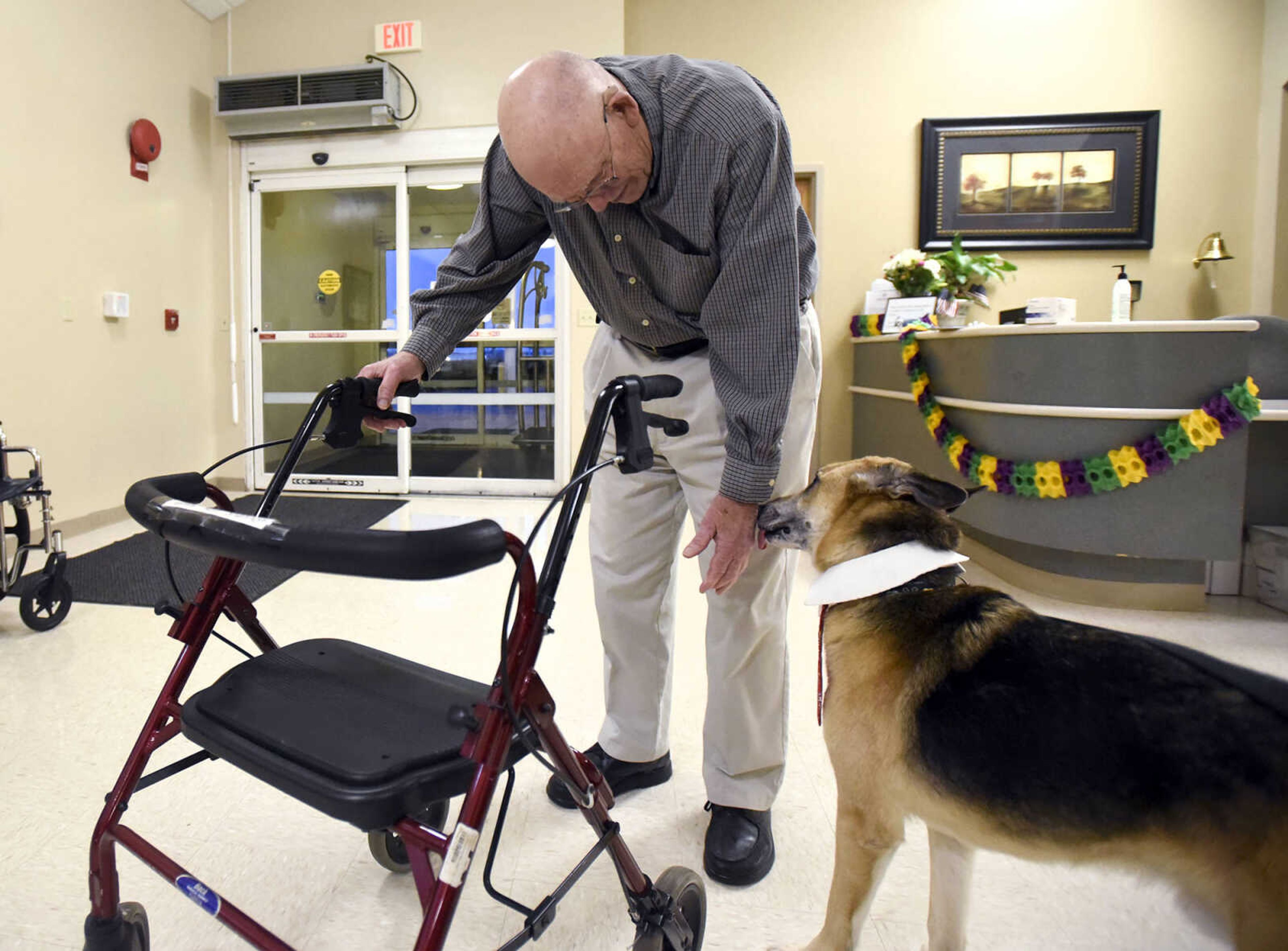 Ron Shannon visits with Max on Tuesday, Feb. 21, 2017, during the Pet Pals stop at the Missouri Veteran's Home in Cape Girardeau.