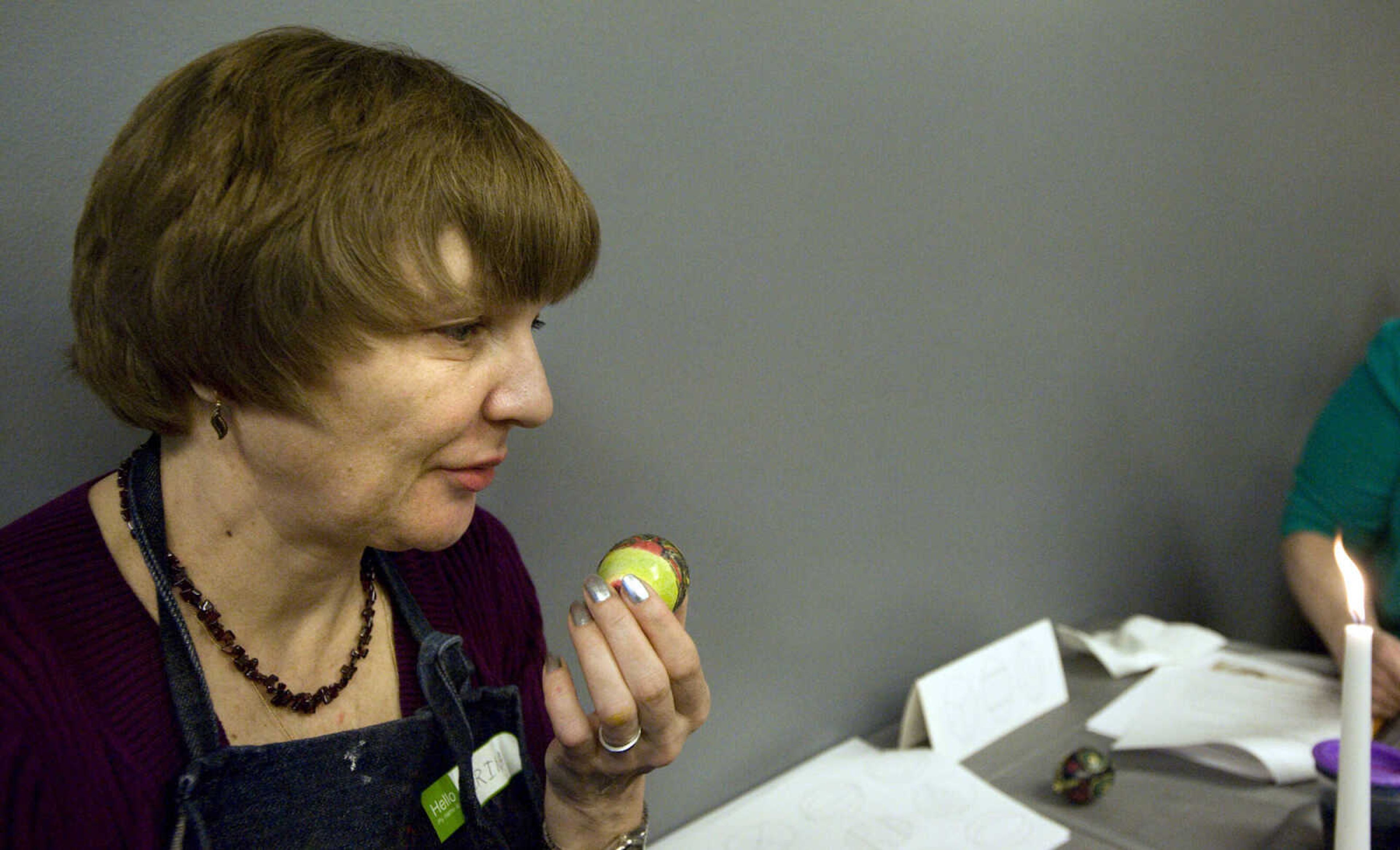 LAURA SIMON ~ lsimon@semissourian.com
Irina Stallion blows on her egg to help it dry Tuesday, March 19, 2013 during the Wonderful World of Pysanky workshop at Southeast Missouri State University's River Campus.