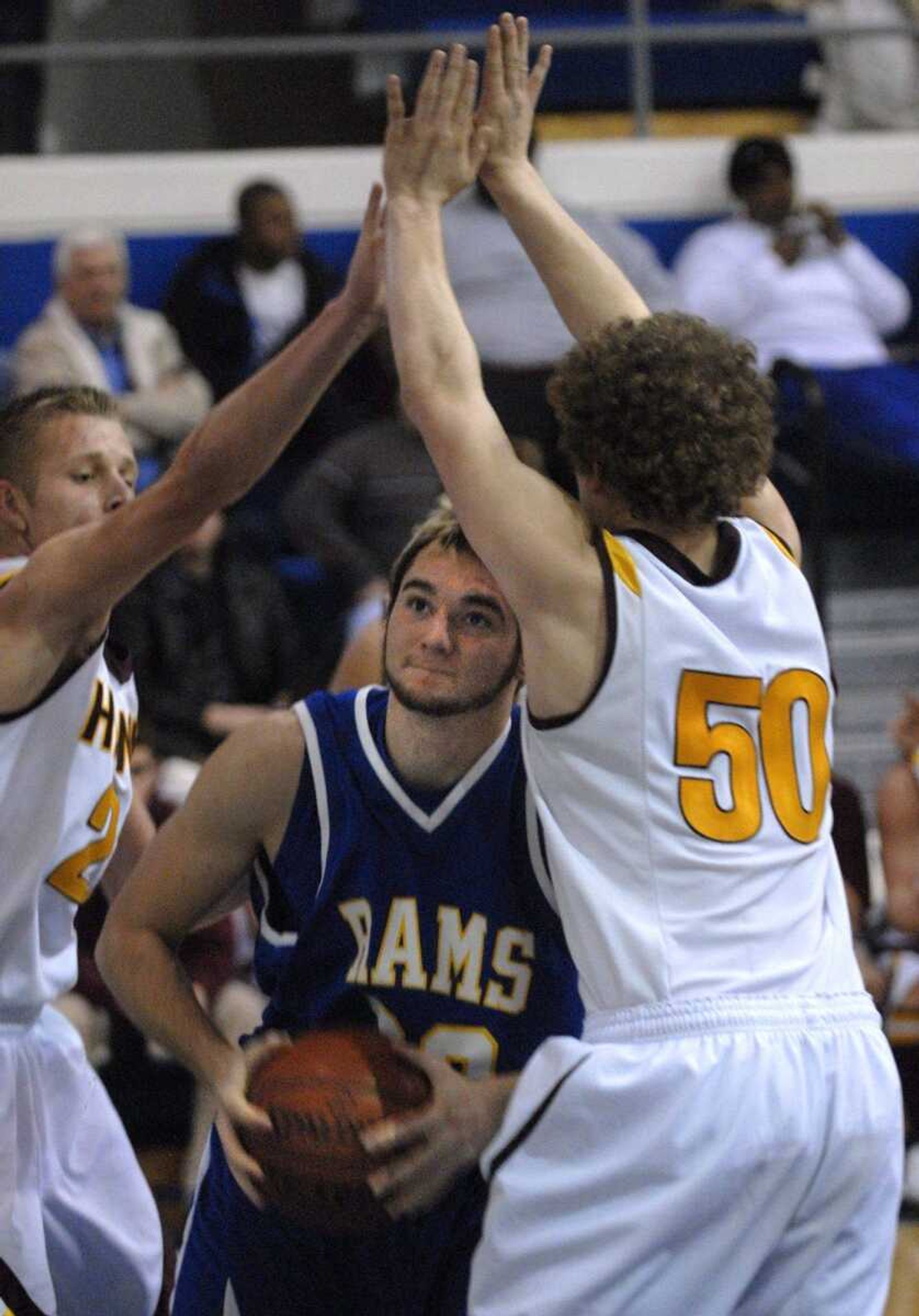 Scott City's Caleb Anderson finds himself double-teamed by Kelly's Levi Felter and Eric Turley during the first quarter.