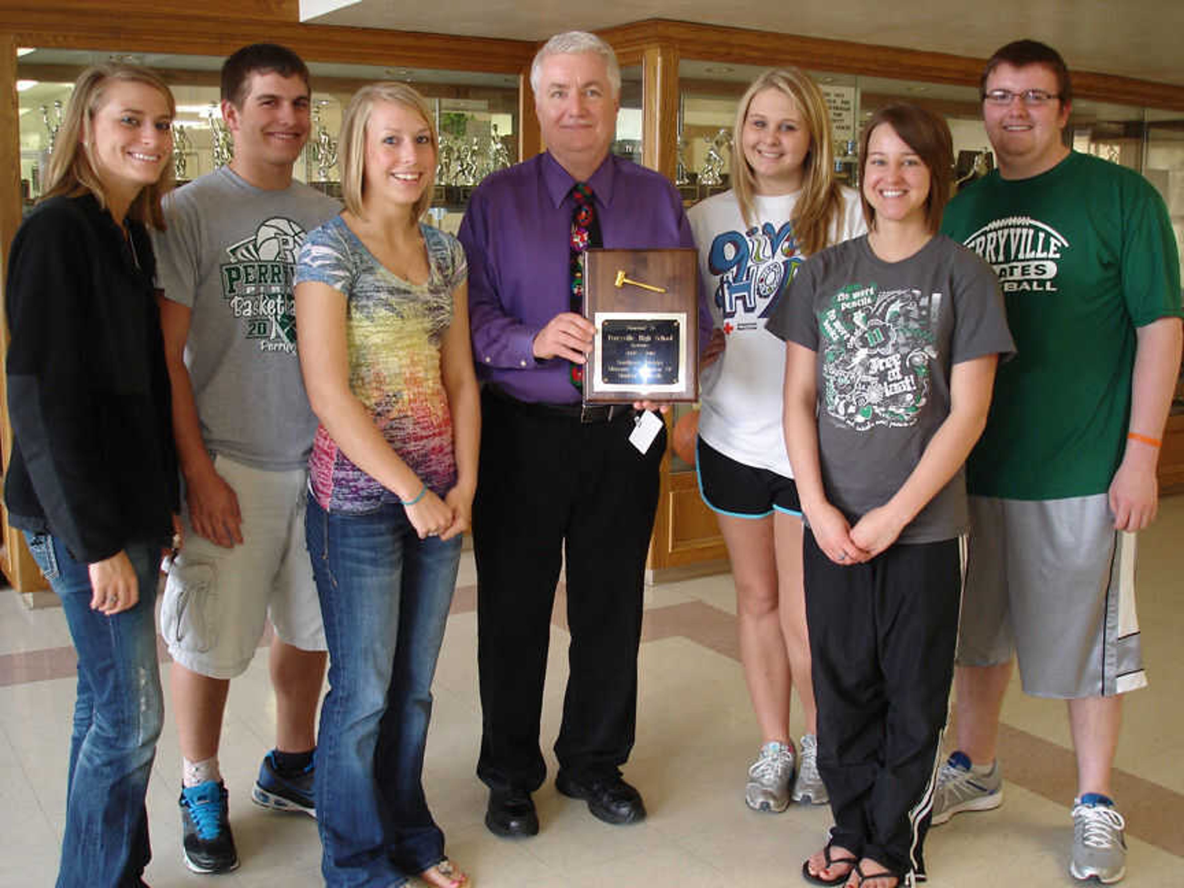 Presenting the award to Perryville High School Principal Lee Gattis are the STUCO officers: (from left) Natalie Hagan, Kirk Hadler, Megan Moldenhauer, Mr. Gattis, Megan Lundy, Natasha Robins, and Dayne Voelker.  The Student Council sponsors are Brent Broeking and Michele Pellikan.