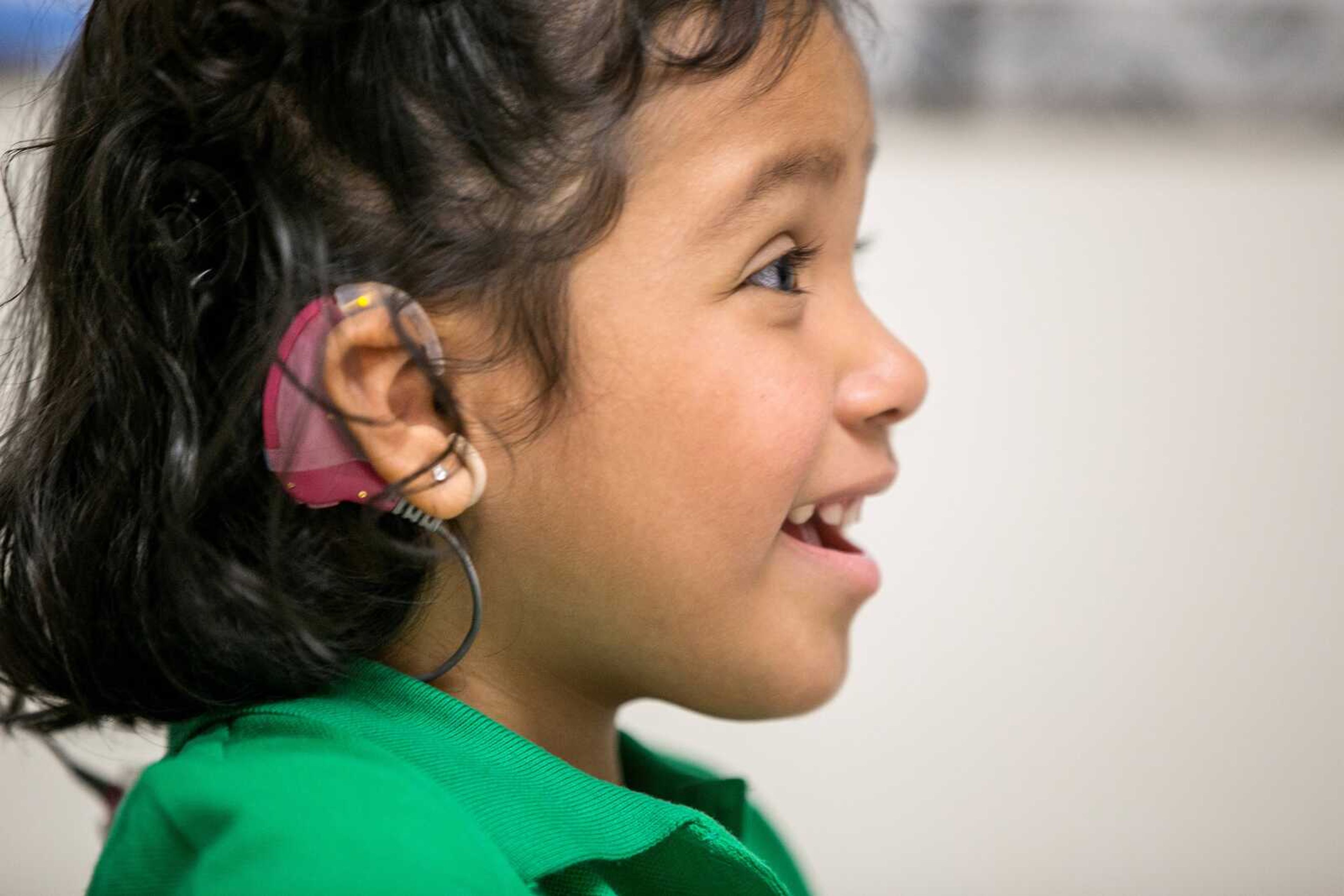 Angelica Lopez, 3, smiles during a therapy session at the University of Southern California in Los Angeles. (Damian Dovarganes ~ Associated Press)