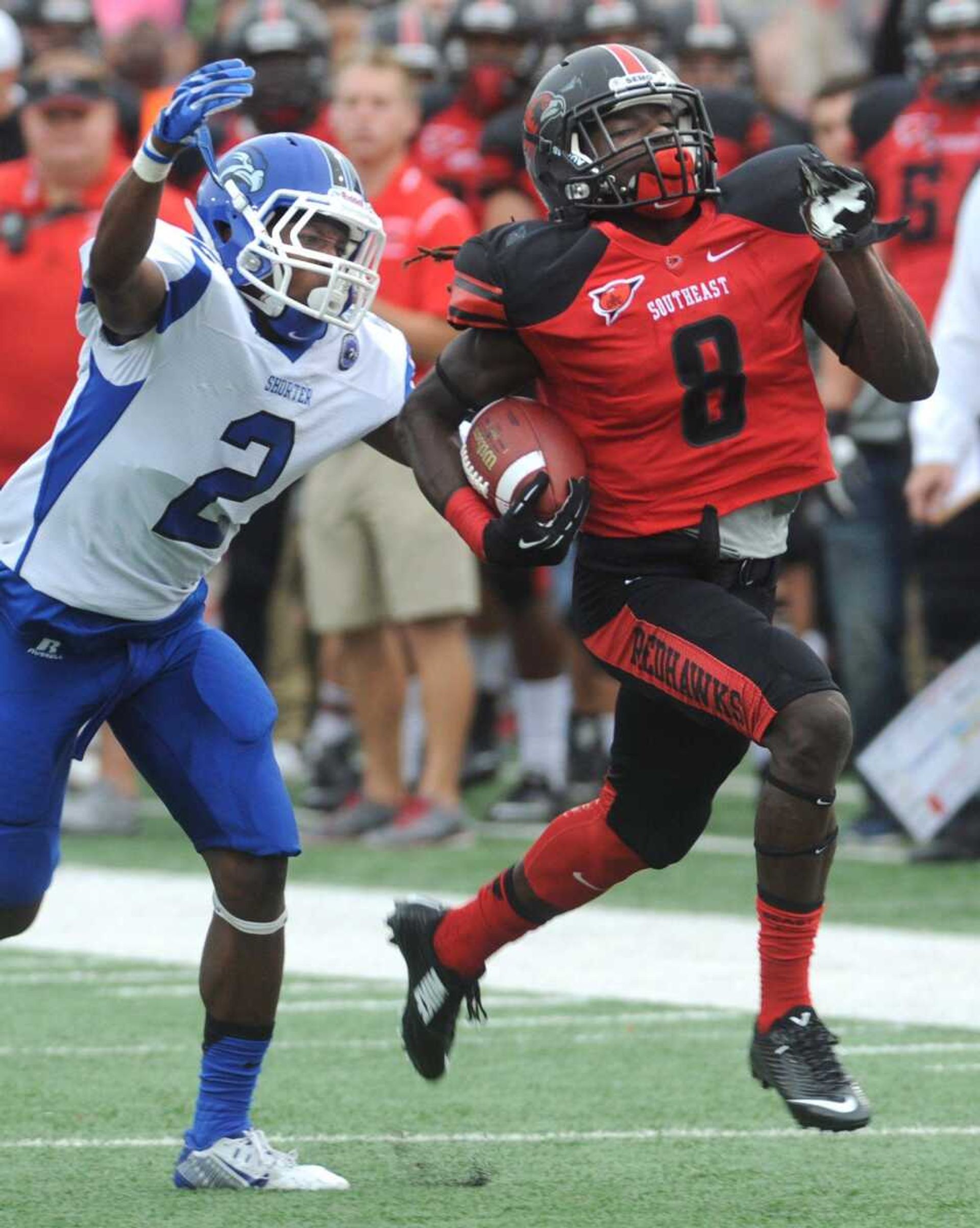 Southeast Missouri State's Tremane McCullough leads Shorter's Willy Dorcin in a chase along the sideline during the second quarter Saturday, Sept. 26, 2015 at Houck Stadium. (Fred Lynch)