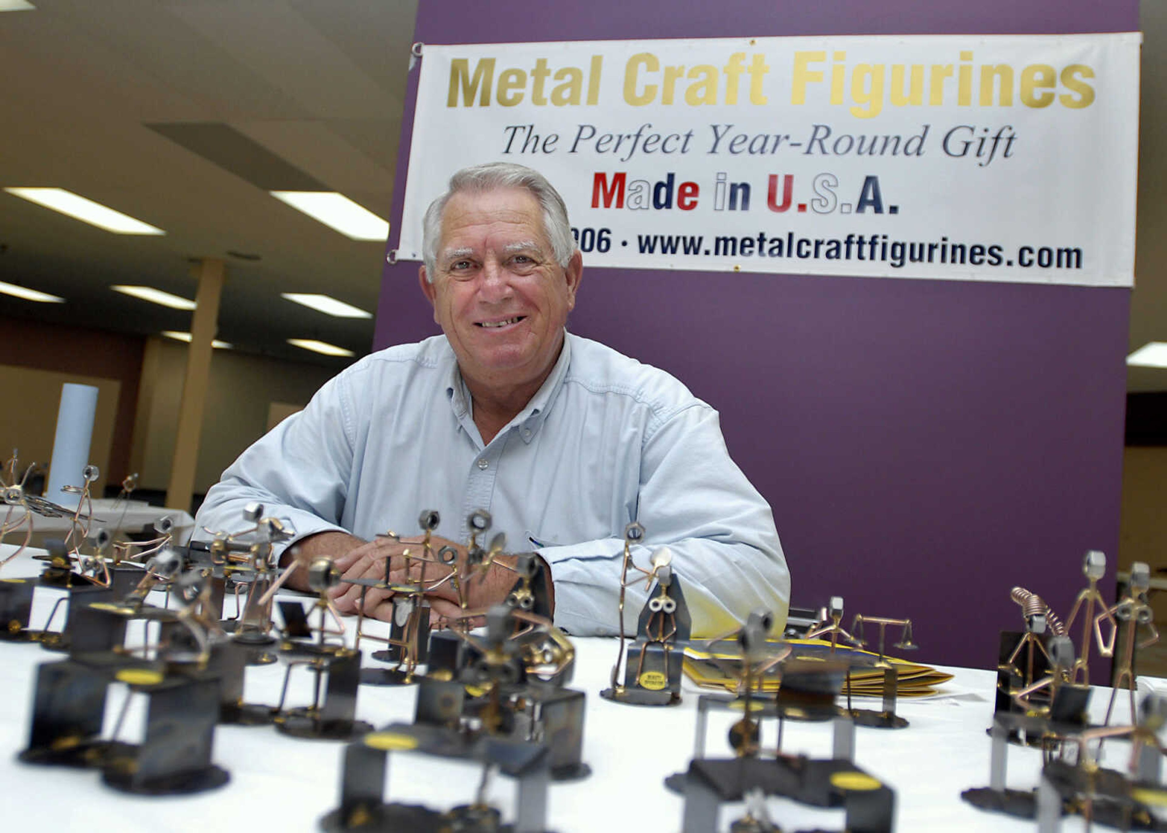 KRISTIN EBERTS ~ keberts@semissourian.com

Bill Parker of Metal Craft Figurines sits at his booth during a craft fair sponsored by the Golden Needle in Cape Girardeau on Saturday, Nov. 19, 2011.