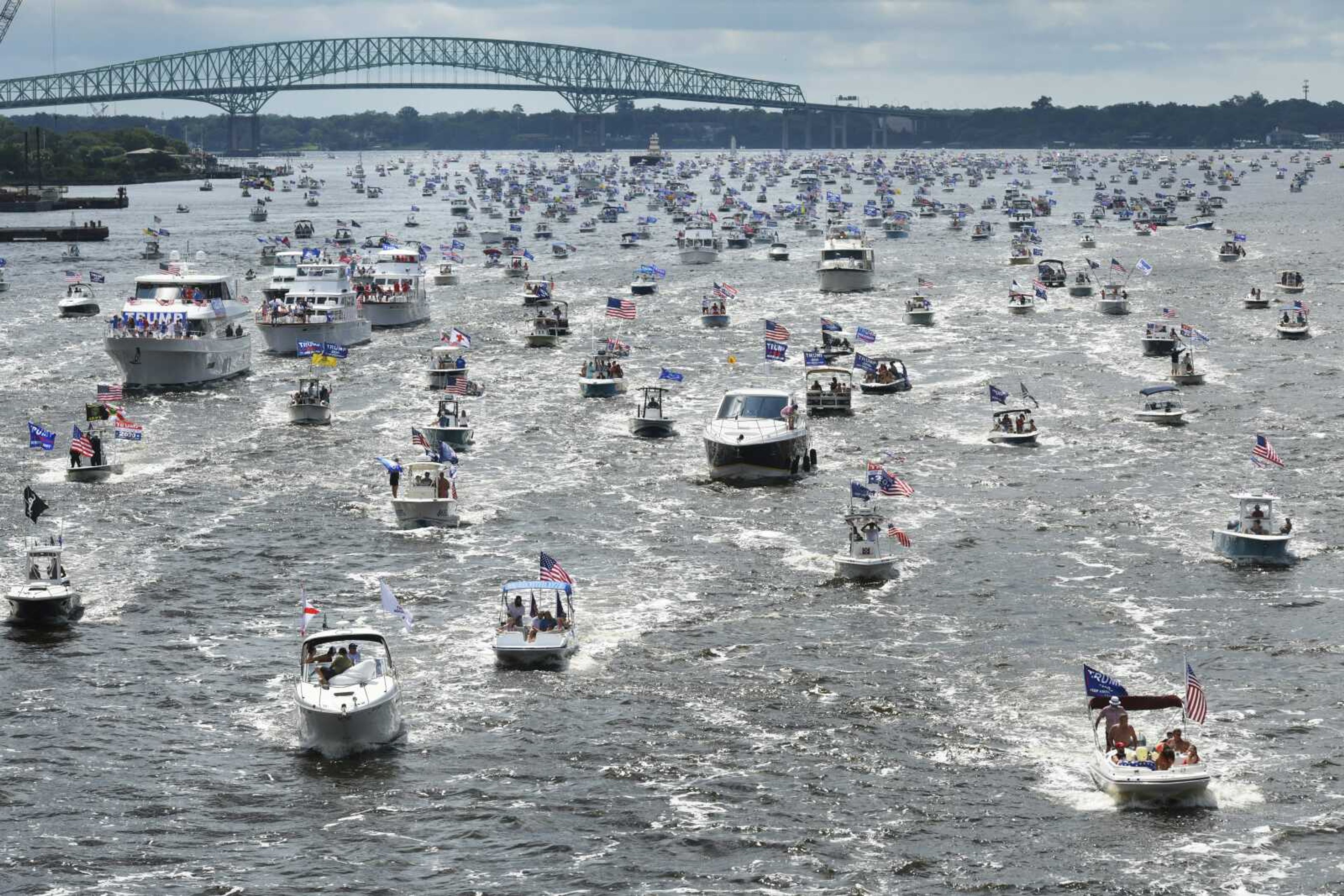 Hundreds of boats idle through downtown on the St. Johns River during a rally Sunday in Jacksonville, Florida, celebrating President Donald Trump's birthday.