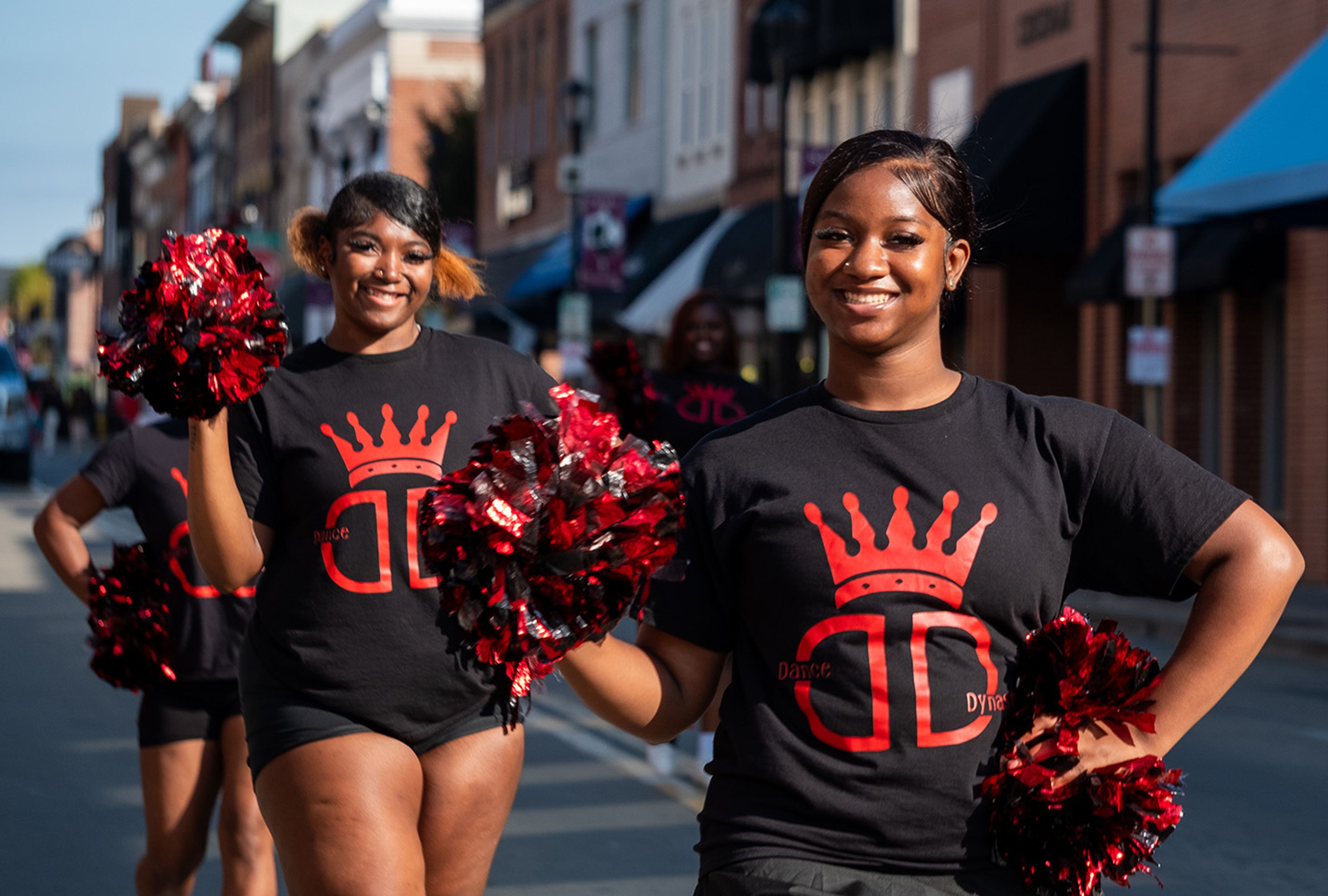 Dance Dynasty members Zikarah Murphy and Dee from St. Louis raise their pom-poms with a smile.